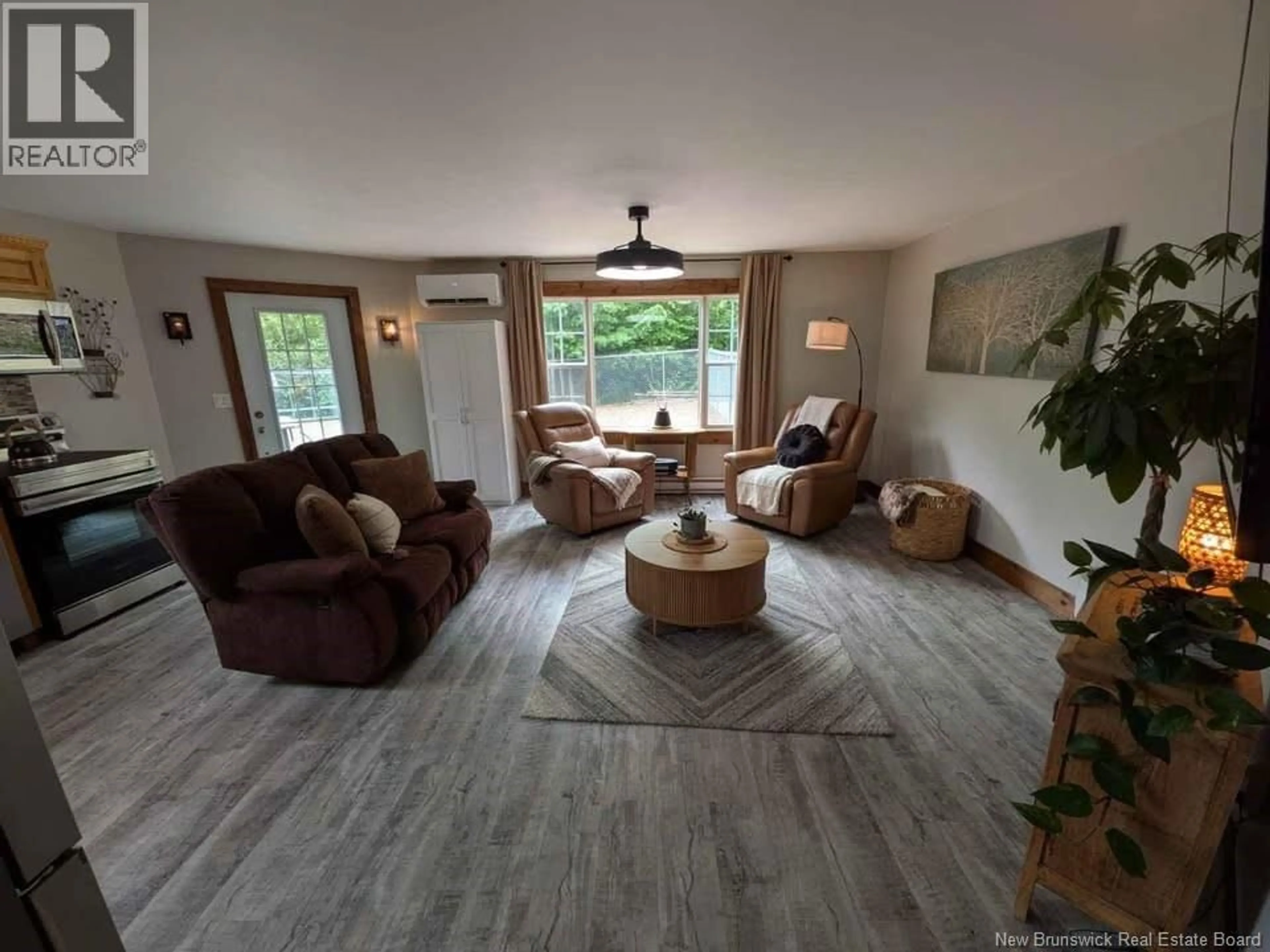 Living room with furniture, wood/laminate floor for 274 CARTERS POINT ROAD, Carters Point New Brunswick E5S0A1