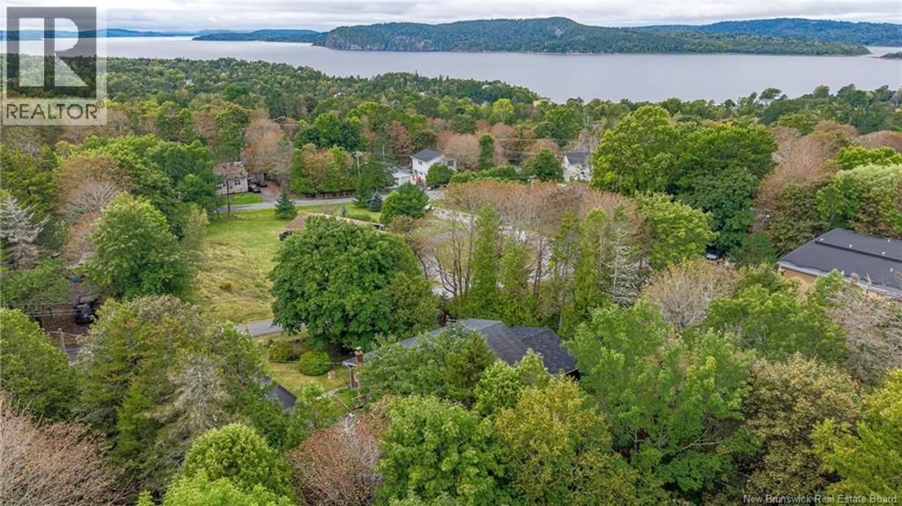 A pic from outside/outdoor area/front of a property/back of a property/a pic from drone, water/lake/river/ocean view for 9 MILNE STREET, Rothesay New Brunswick E2E1Y8