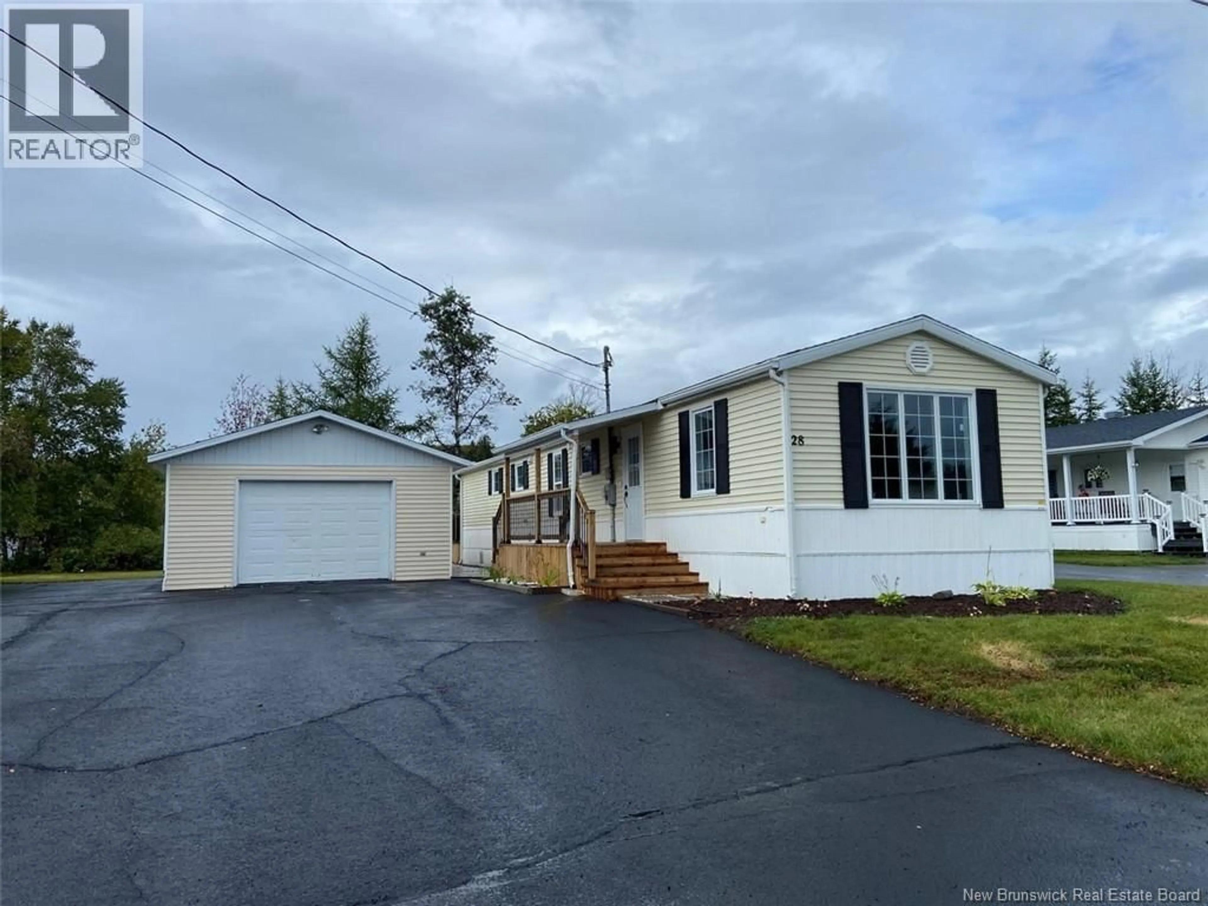 Home with vinyl exterior material, street for 28 LE PARADIS STREET, Saint-Jacques New Brunswick E7B1T7