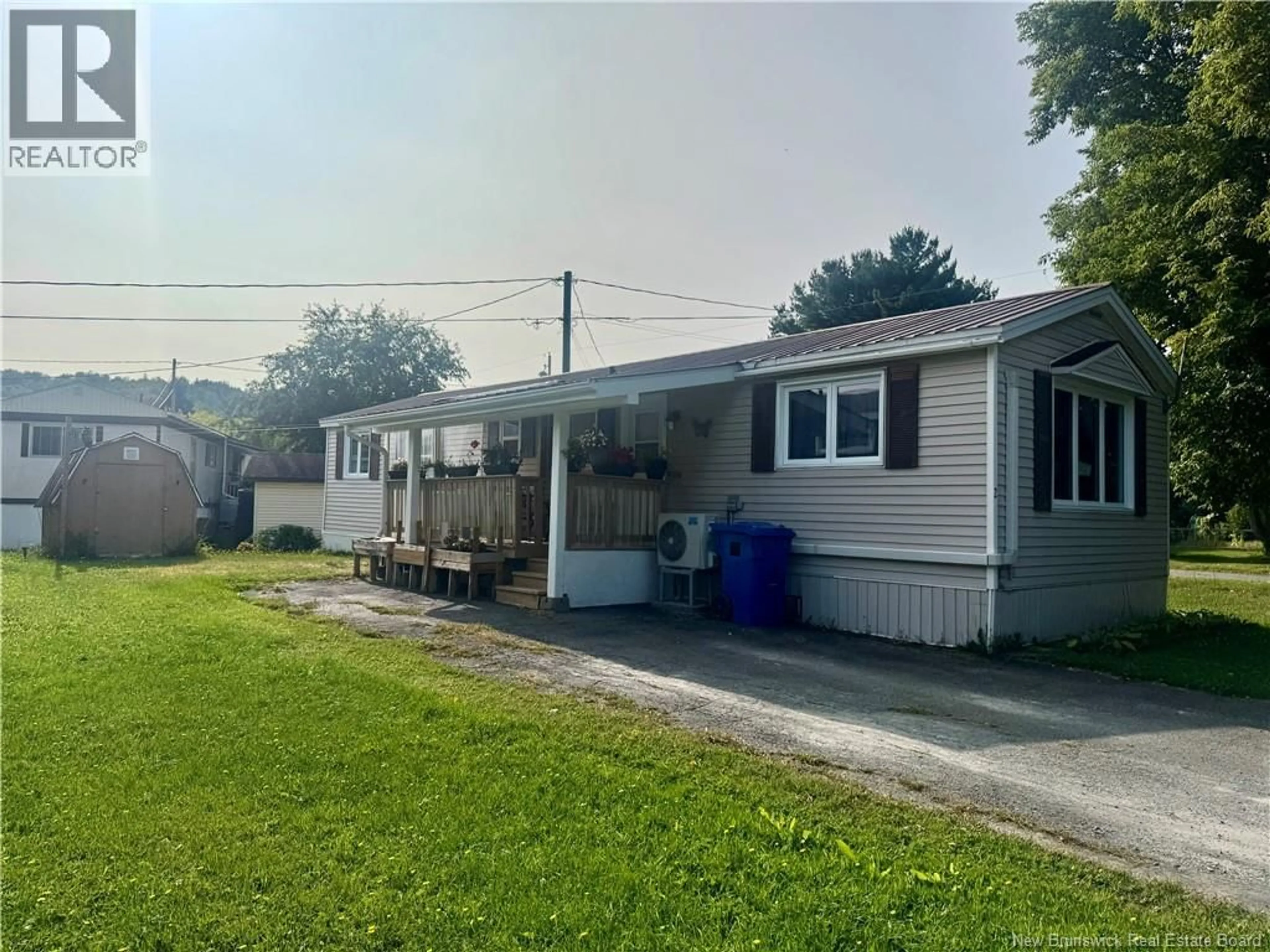 Home with vinyl exterior material, street for 2 POULIN DRIVE, Woodstock New Brunswick E7M2L8