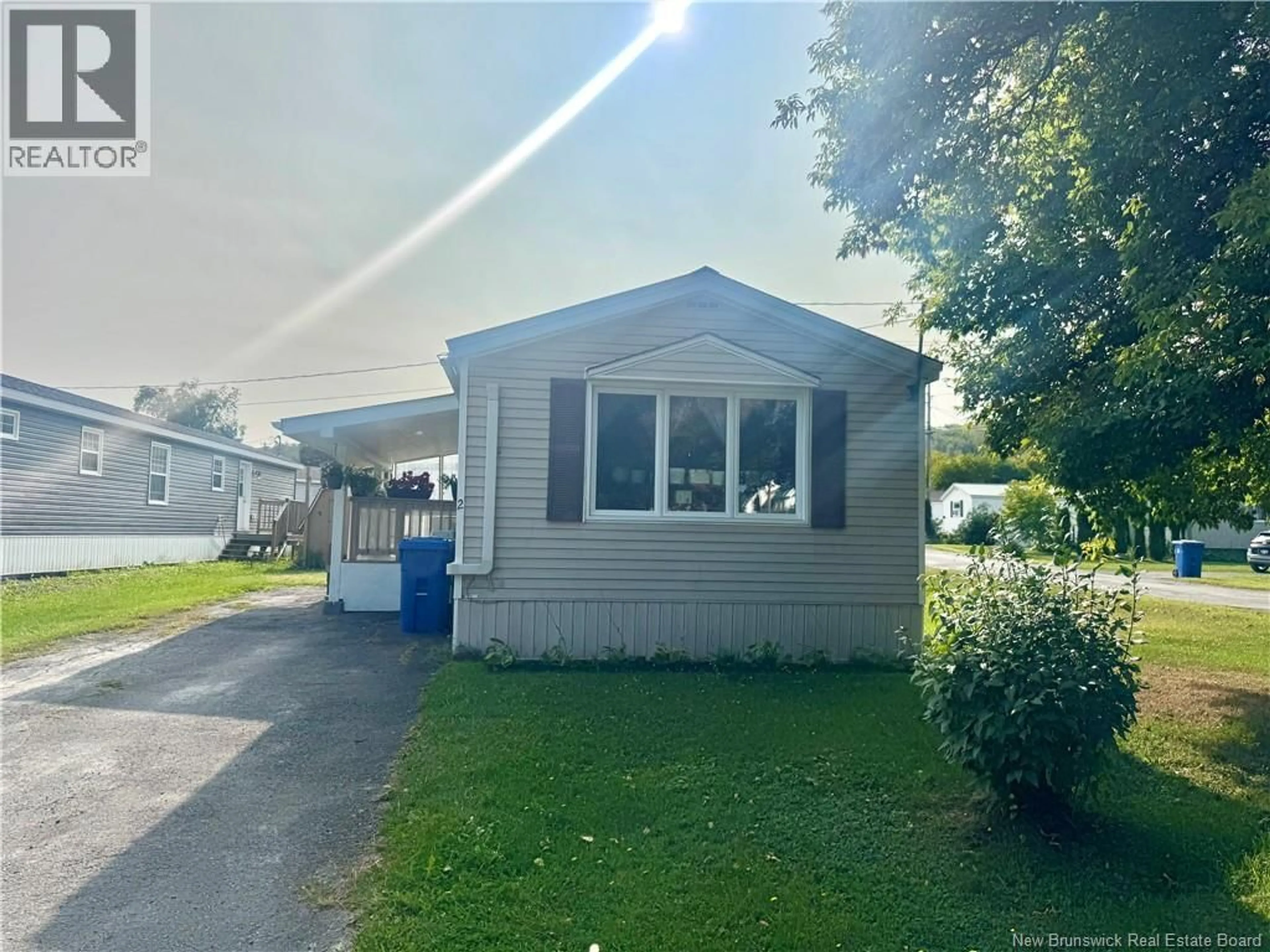Home with vinyl exterior material, street for 2 POULIN DRIVE, Woodstock New Brunswick E7M2L8