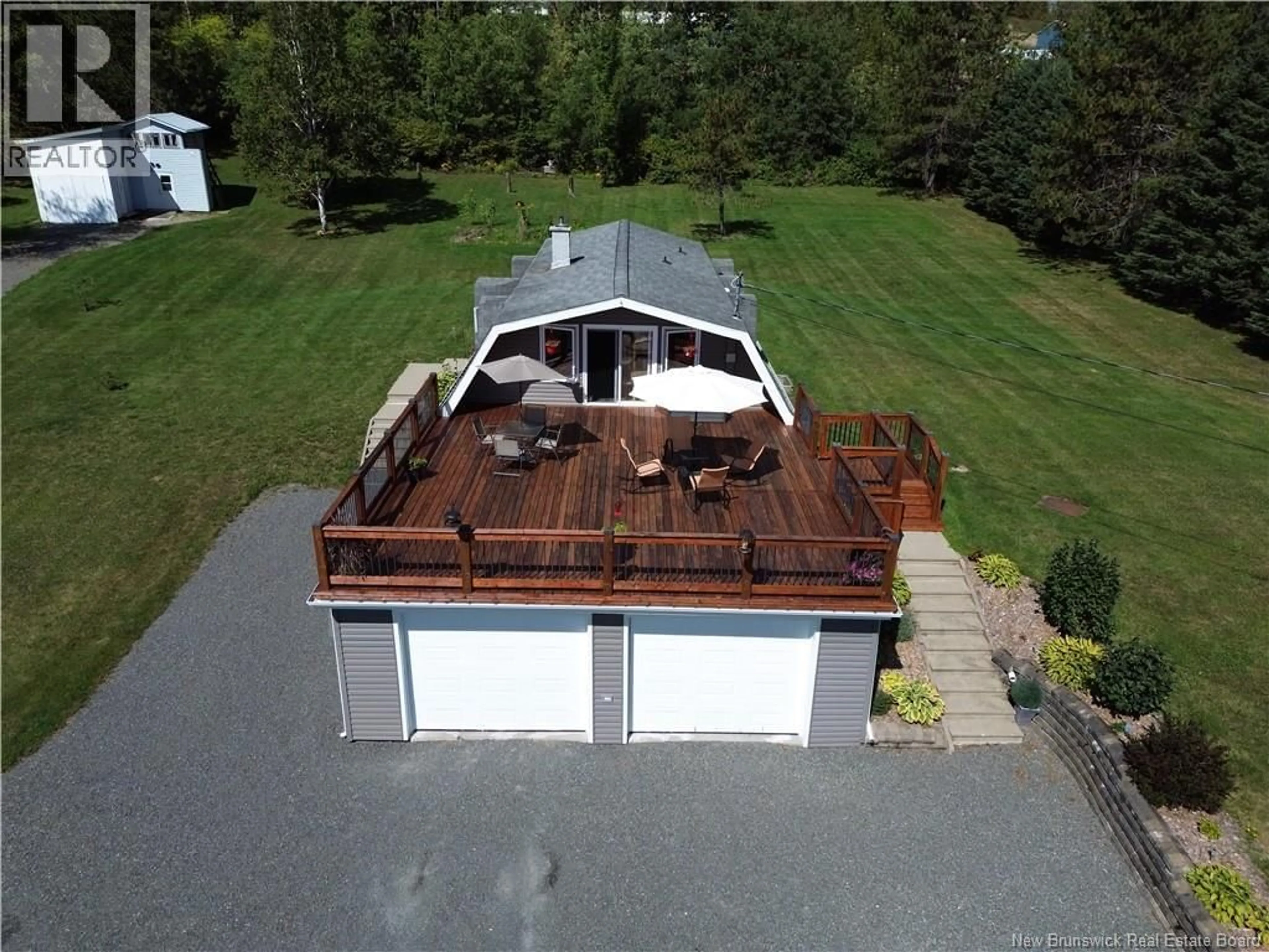 A pic from outside/outdoor area/front of a property/back of a property/a pic from drone, water/lake/river/ocean view for 12 CARON ROAD, DSL de Drummond/DSL of Drummond New Brunswick E3Y1M7