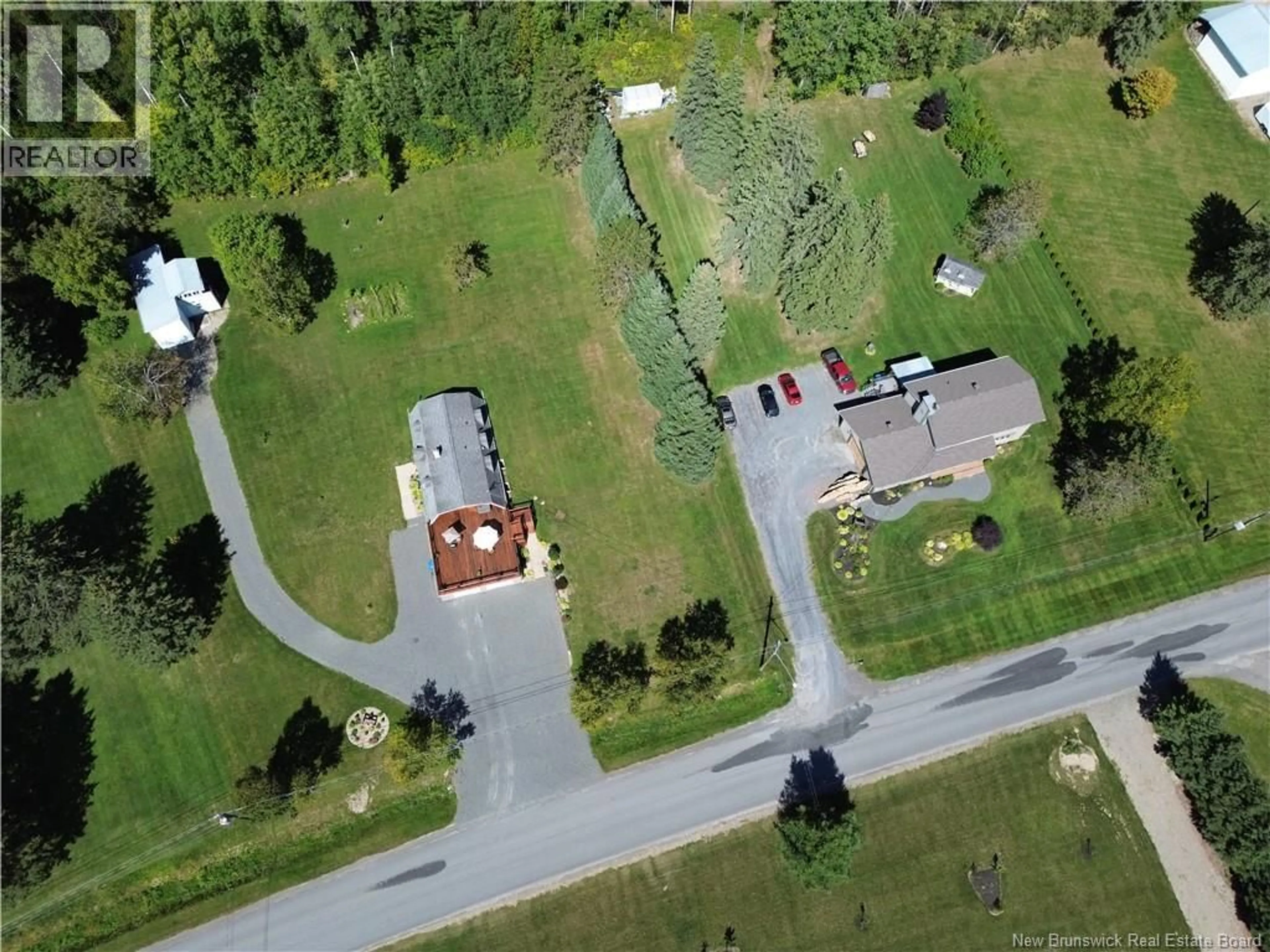 A pic from outside/outdoor area/front of a property/back of a property/a pic from drone, street for 12 CARON ROAD, DSL de Drummond/DSL of Drummond New Brunswick E3Y1M7
