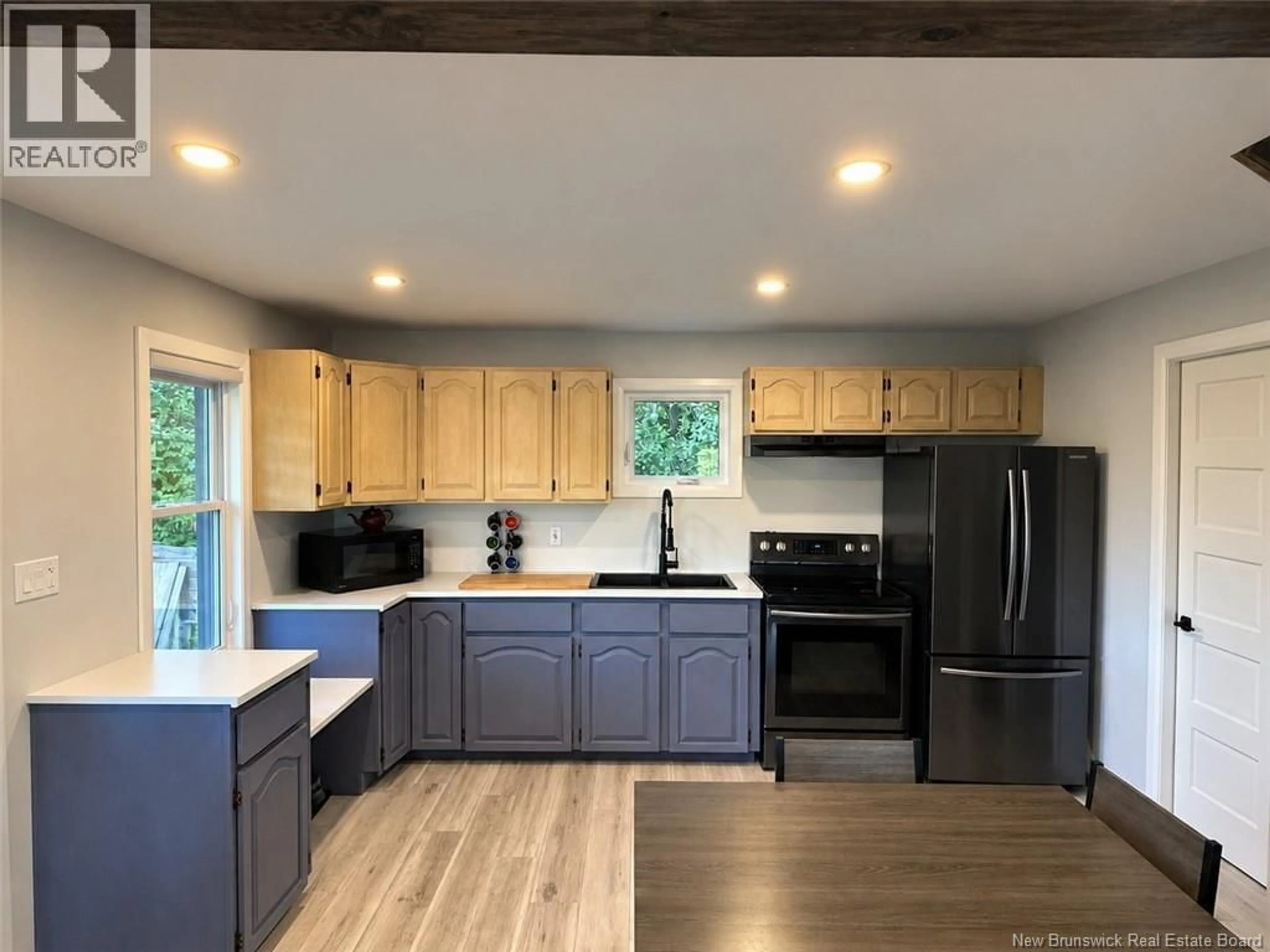 Open concept kitchen, wood/laminate floor for 644 CANADA ROAD, Edmundston New Brunswick E3V1W4