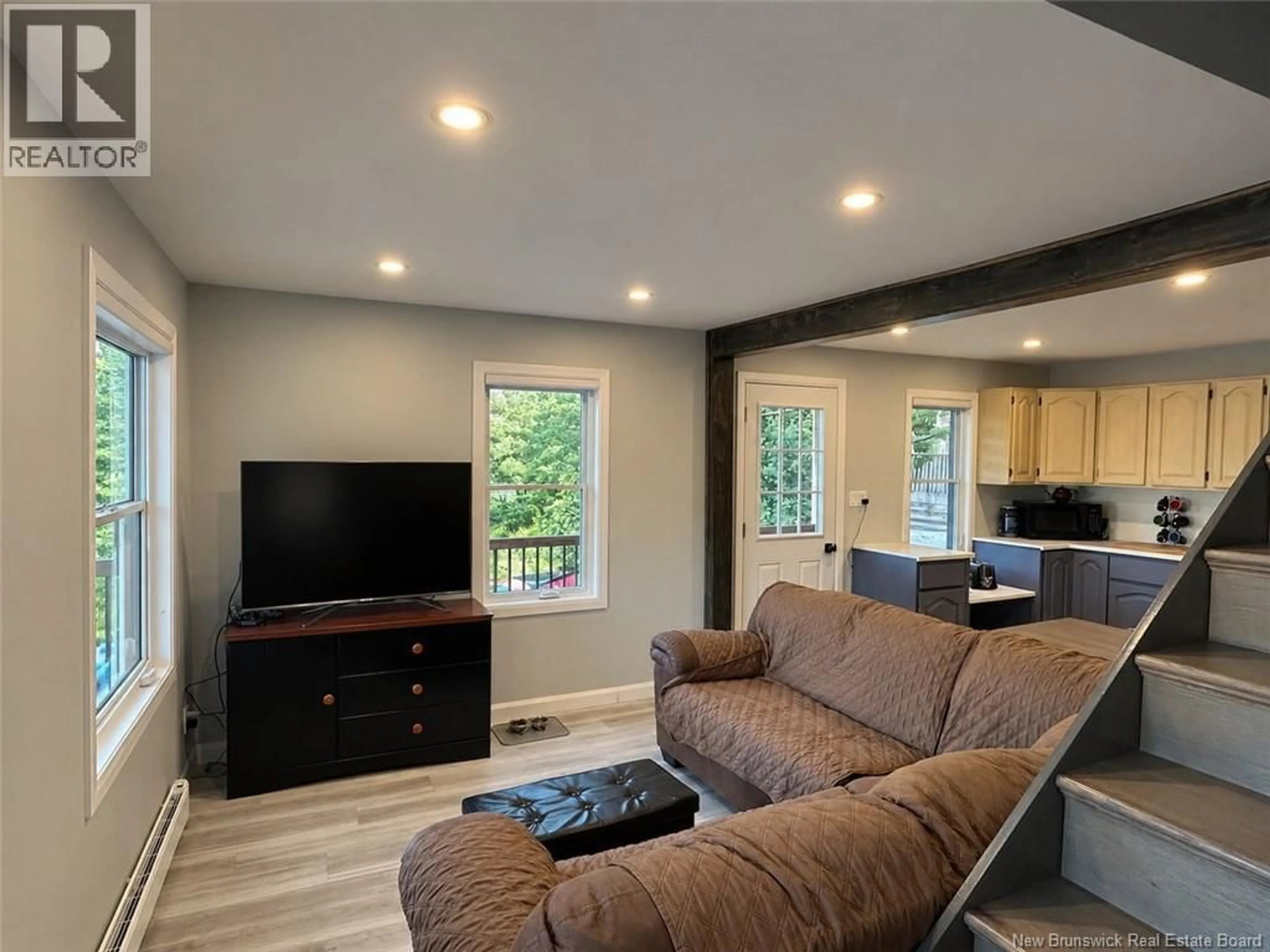 Living room with furniture, wood/laminate floor for 644 CANADA ROAD, Edmundston New Brunswick E3V1W4