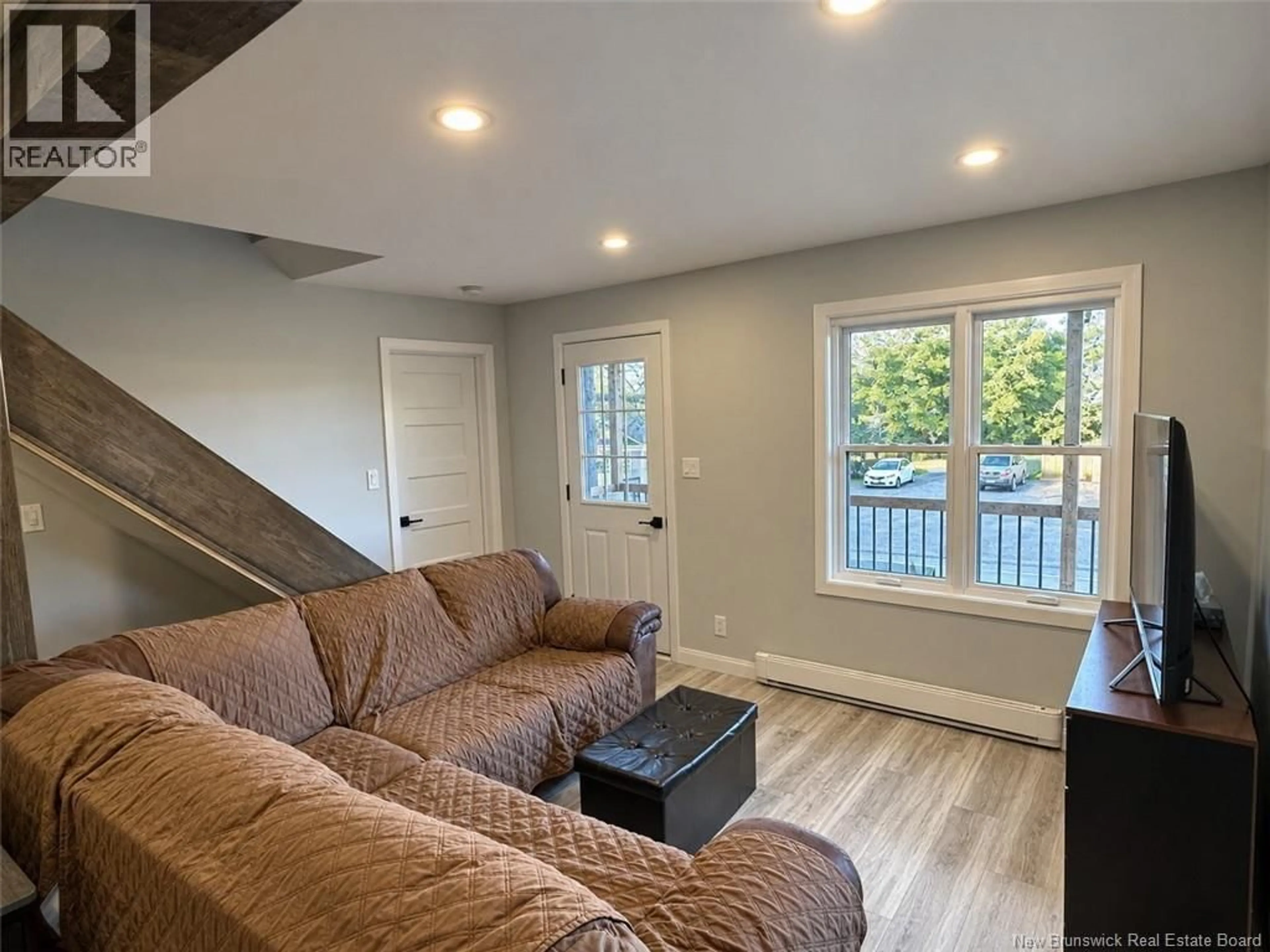 Living room with furniture, wood/laminate floor for 644 CANADA ROAD, Edmundston New Brunswick E3V1W4