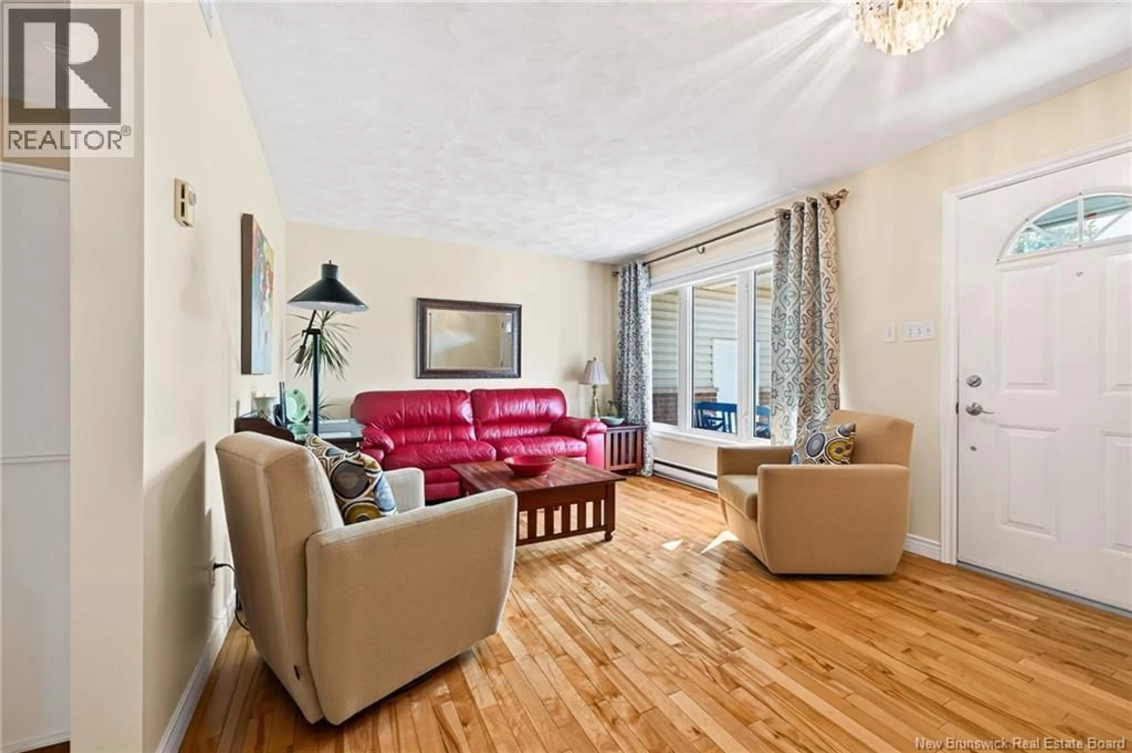 Living room with furniture, wood/laminate floor for 310 VANIER STREET, Dieppe New Brunswick E1A5N2