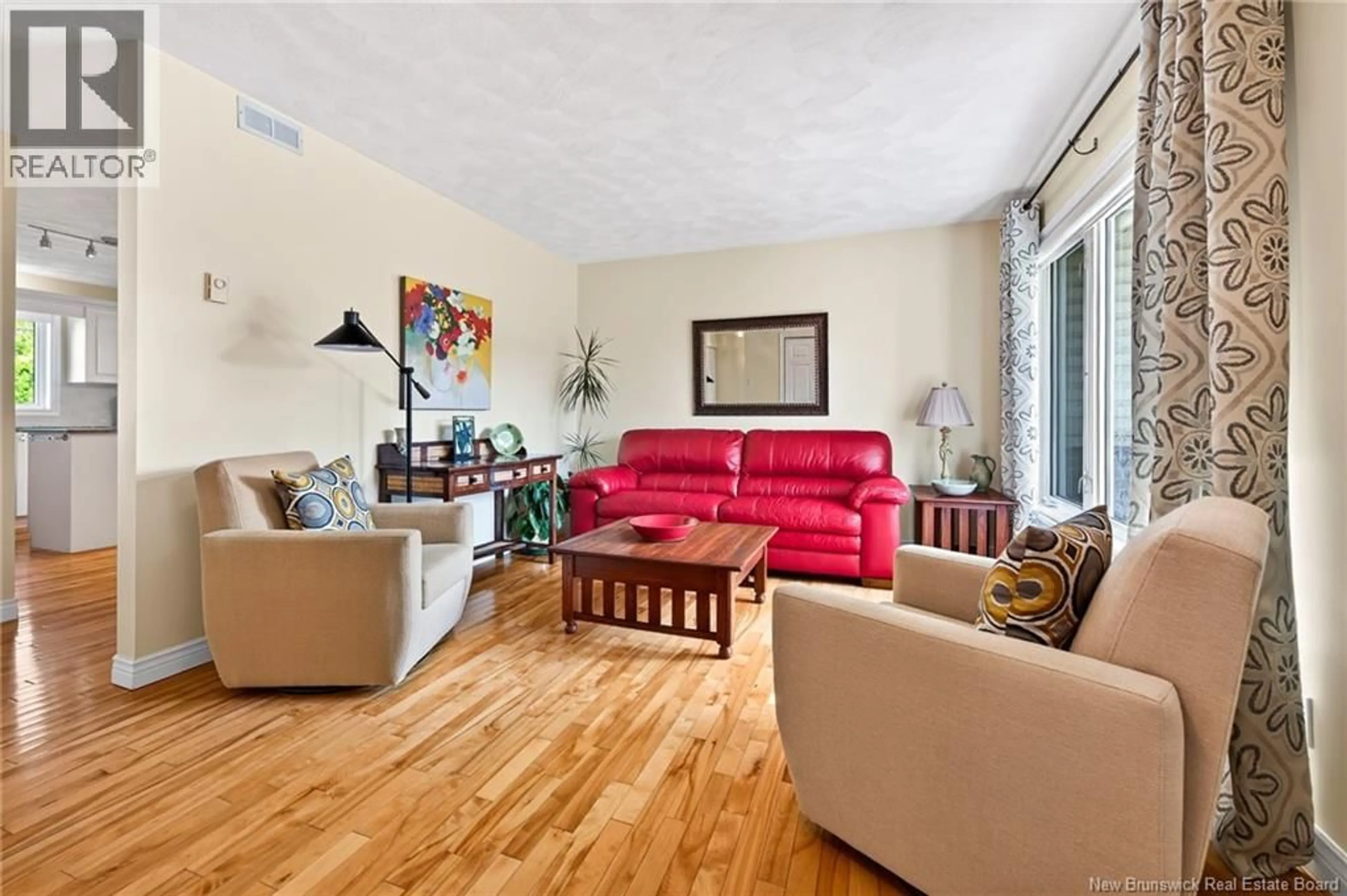 Living room with furniture, wood/laminate floor for 310 VANIER STREET, Dieppe New Brunswick E1A5N2