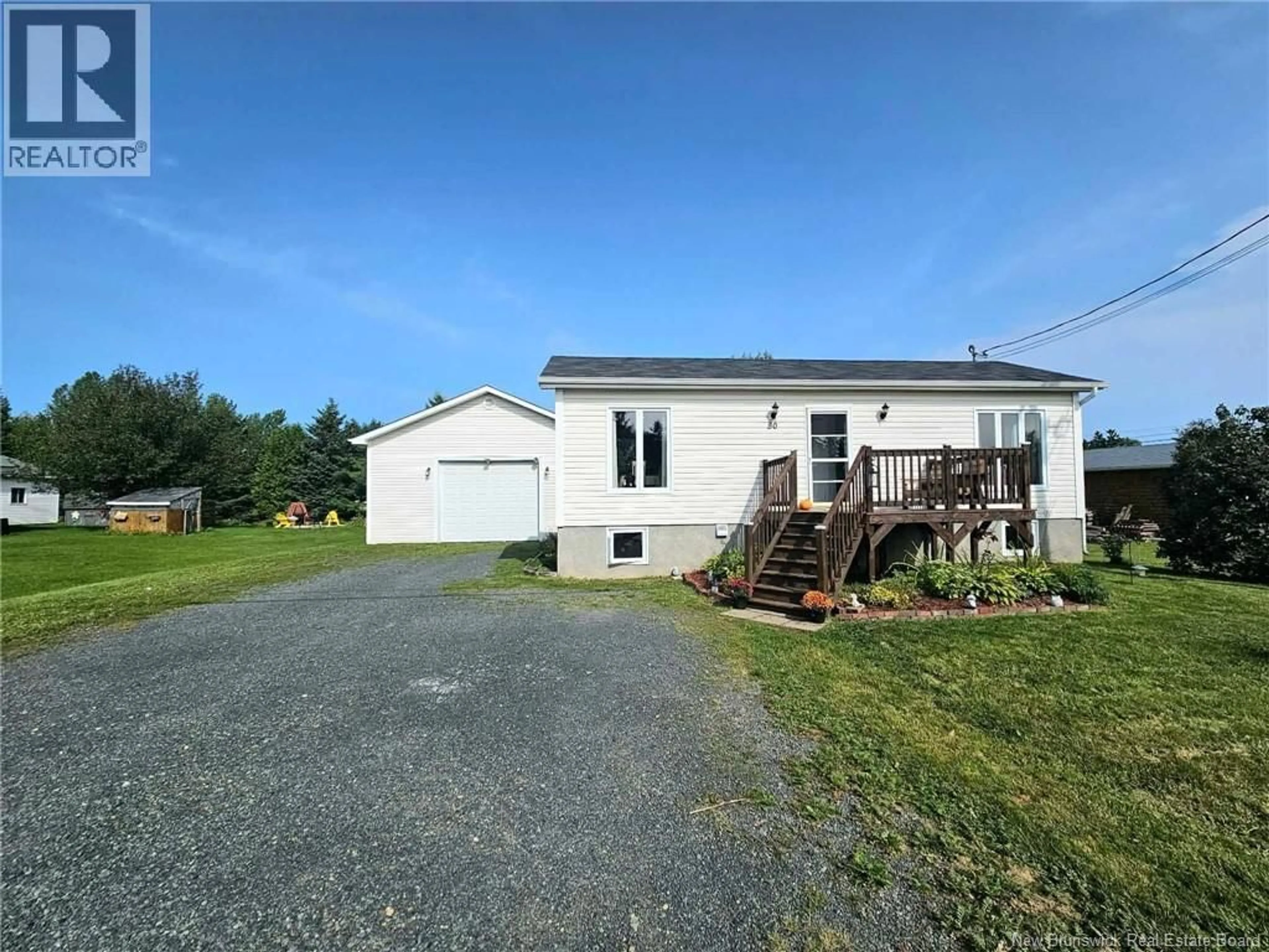 A pic from outside/outdoor area/front of a property/back of a property/a pic from drone, unknown for 80 RUE DE LA GARE, Pointe-Verte New Brunswick E8J2Z1