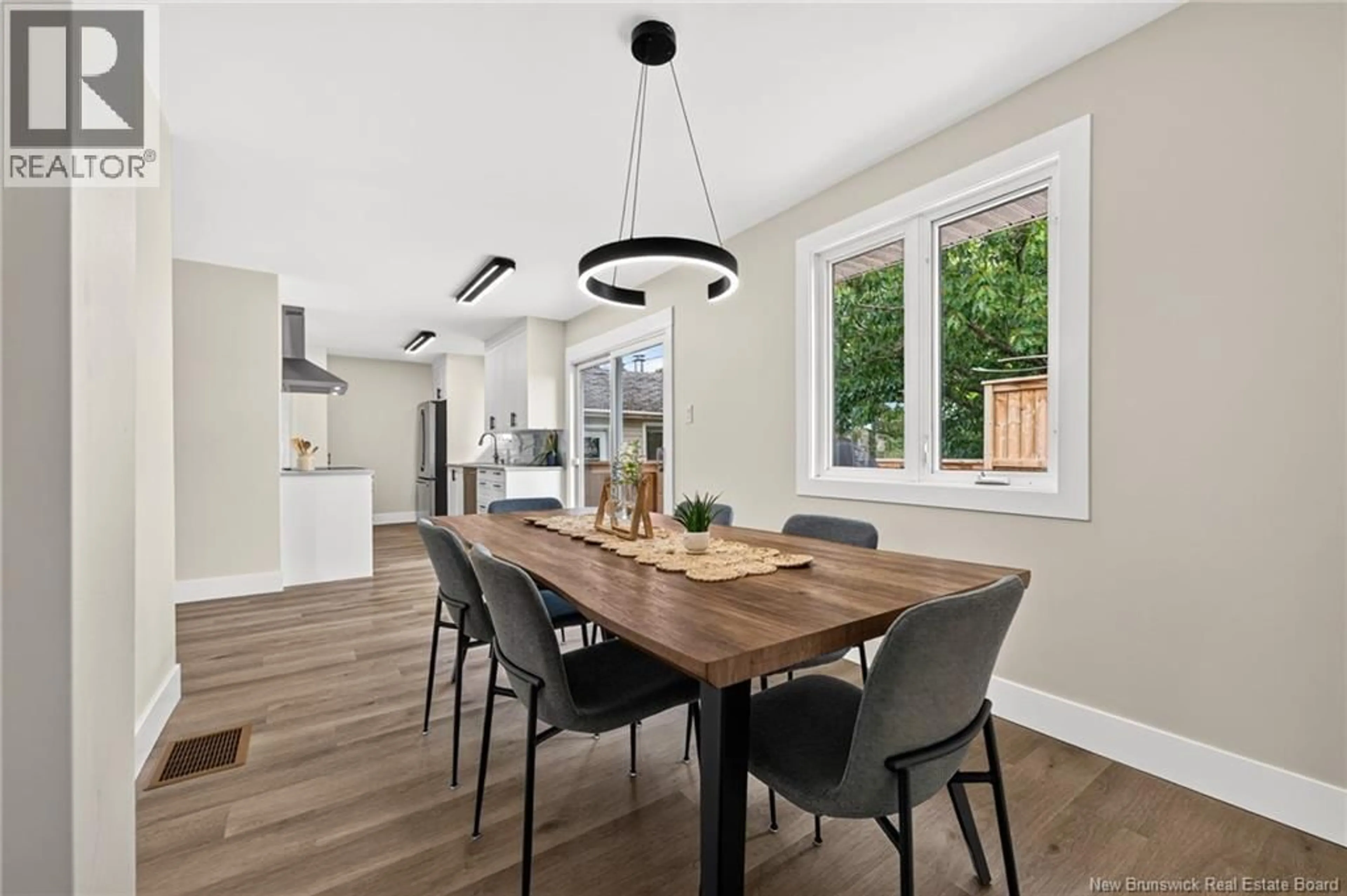 Open concept kitchen, wood/laminate floor for 10 KINGSWAY CRESCENT, Moncton New Brunswick E1G1G4