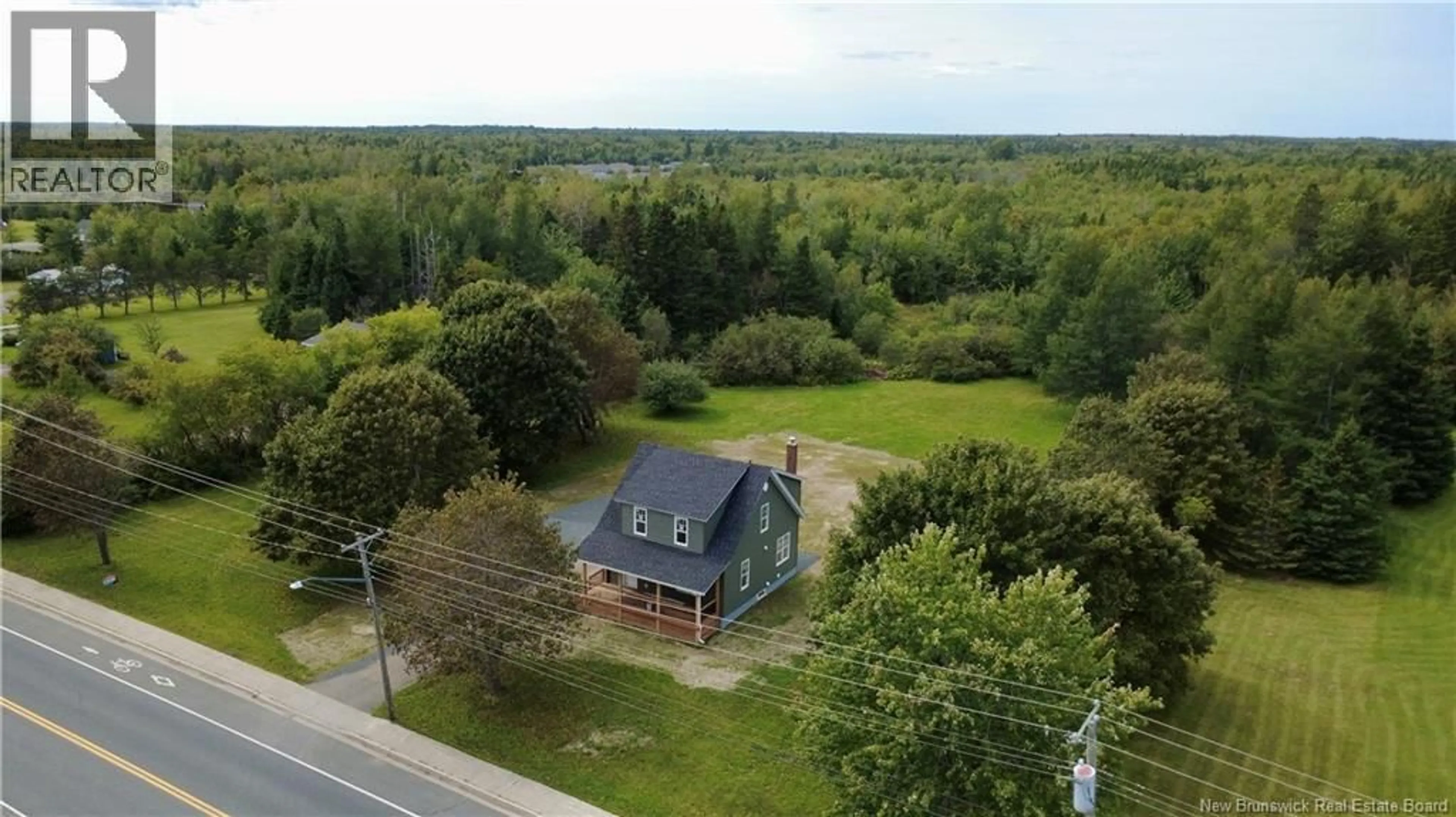 A pic from outside/outdoor area/front of a property/back of a property/a pic from drone, water/lake/river/ocean view for 4069 RUE PRINCIPALE, Tracadie New Brunswick E1X1B7