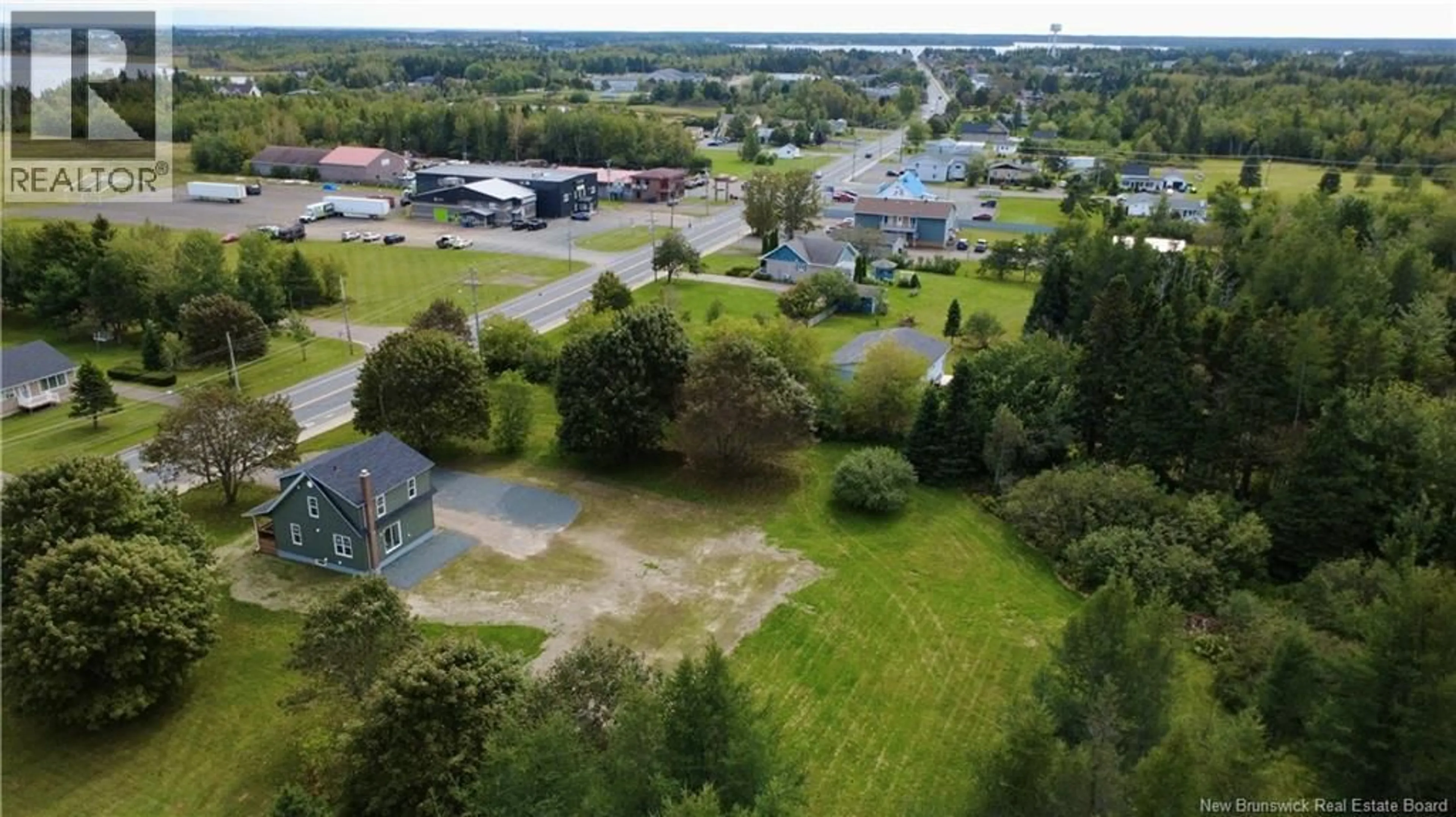 A pic from outside/outdoor area/front of a property/back of a property/a pic from drone, unknown for 4069 RUE PRINCIPALE, Tracadie New Brunswick E1X1B7