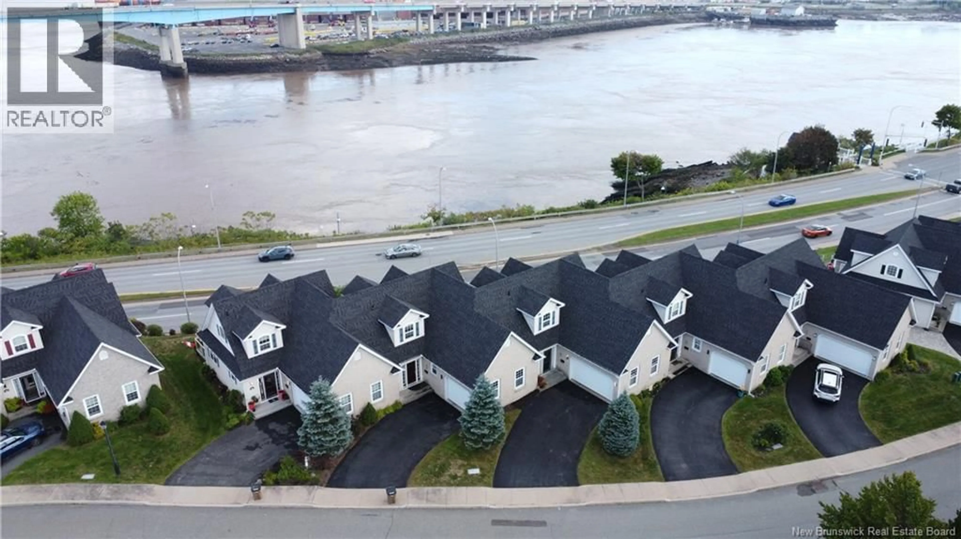 A pic from outside/outdoor area/front of a property/back of a property/a pic from drone, water/lake/river/ocean view for 16 CLIPPER PASSAGE, Saint John New Brunswick E2K0A9