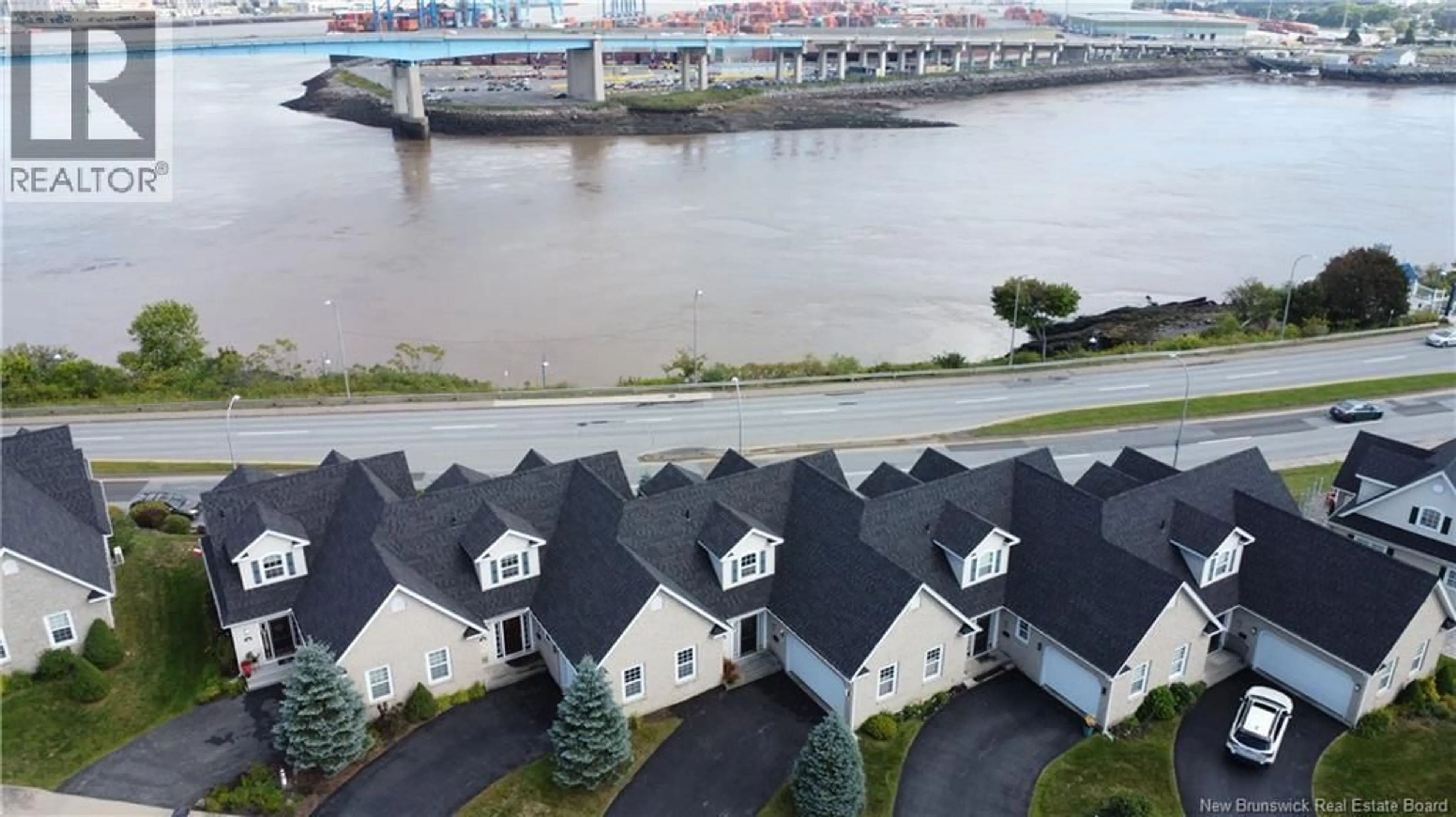 A pic from outside/outdoor area/front of a property/back of a property/a pic from drone, water/lake/river/ocean view for 16 CLIPPER PASSAGE, Saint John New Brunswick E2K0A9