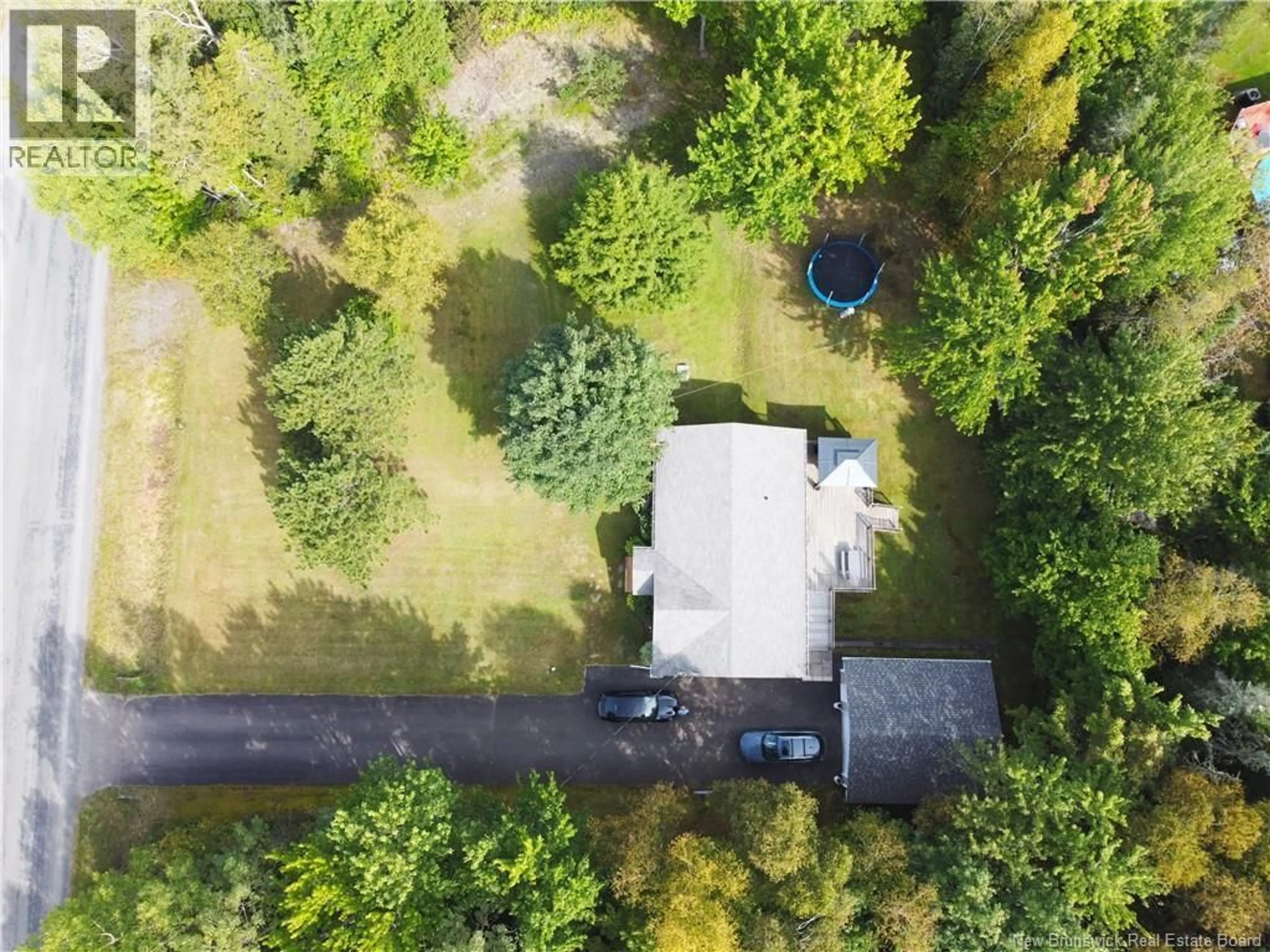 A pic from outside/outdoor area/front of a property/back of a property/a pic from drone, unknown for 32 MENZIES DRIVE, Hanwell New Brunswick E3C1M6