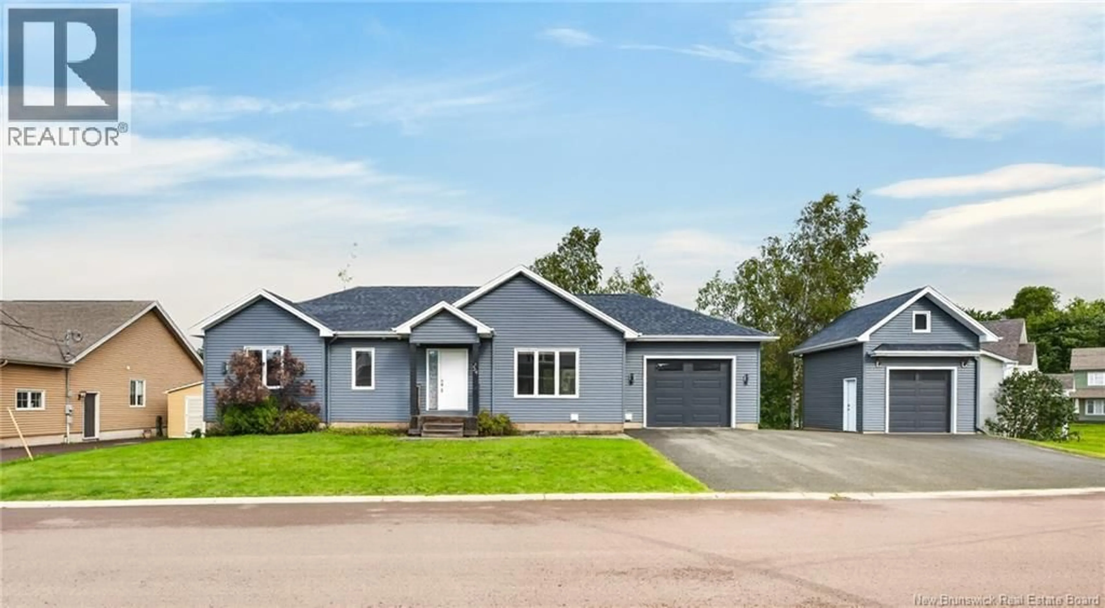 Home with vinyl exterior material, street for 54 DES AUBES, Dieppe New Brunswick E1A0Y3