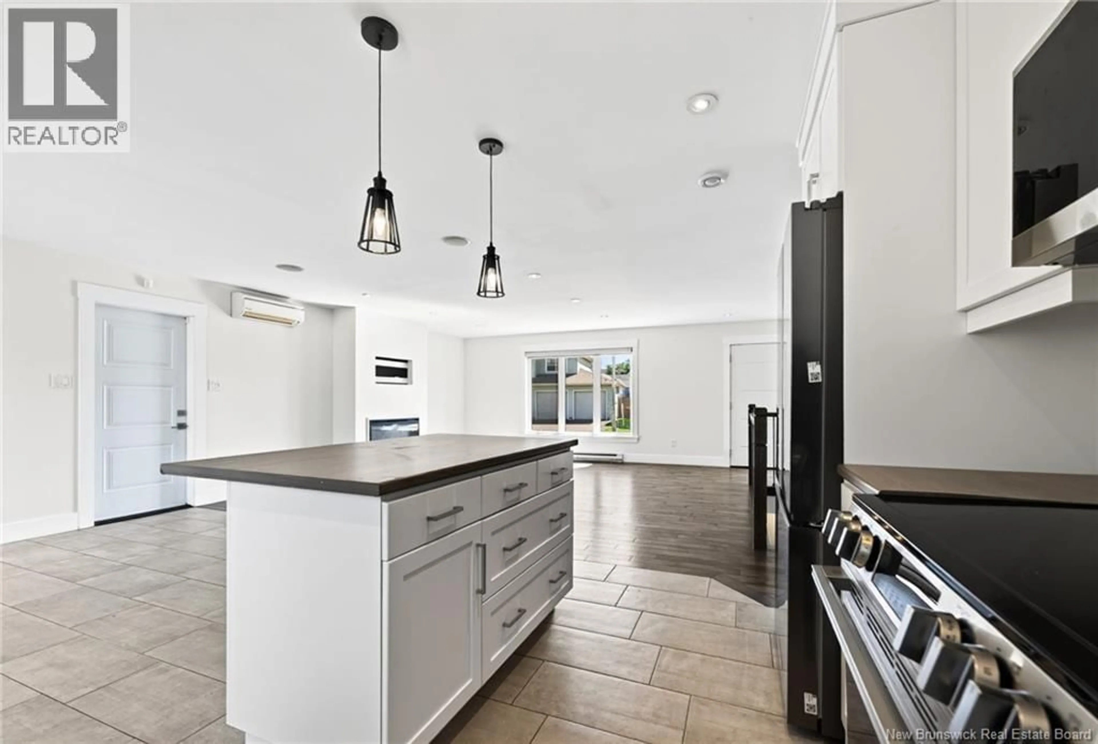 Open concept kitchen, ceramic/tile floor for 54 DES AUBES, Dieppe New Brunswick E1A0Y3