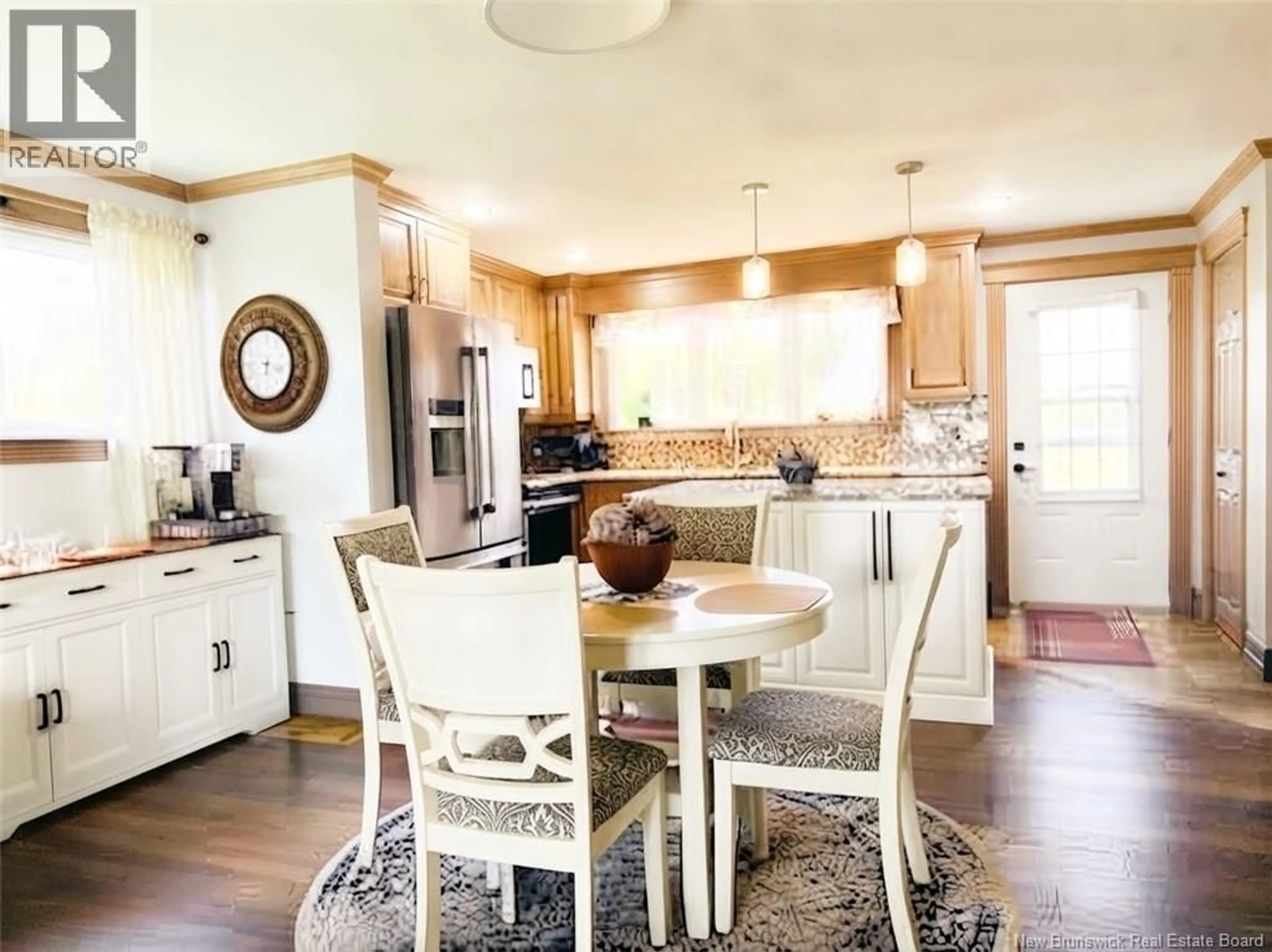 Open concept kitchen, wood/laminate floor for 10 THIBODEAU LANE, Baie-Sainte-Anne New Brunswick E9A1G1