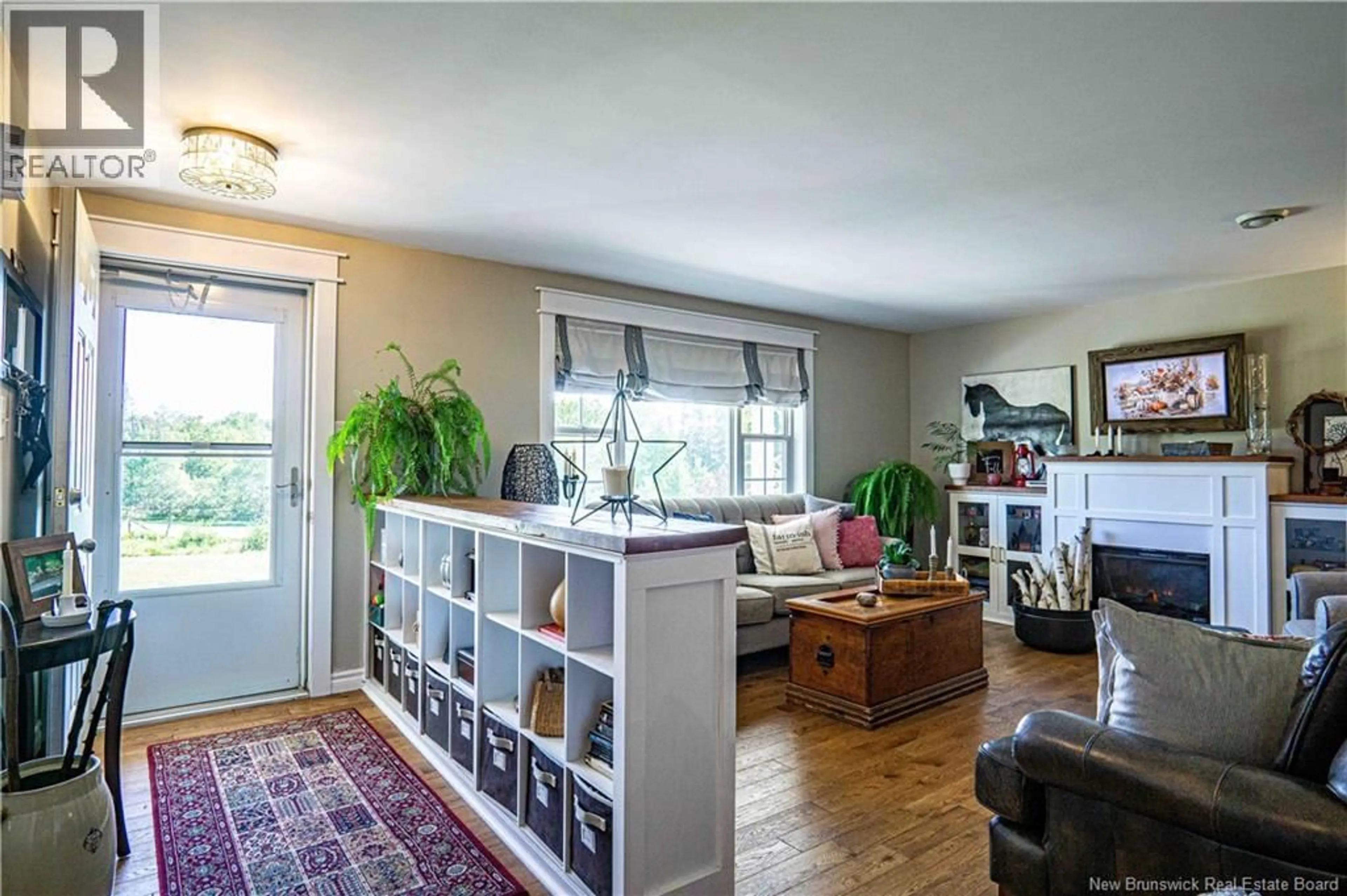 Living room with furniture, wood/laminate floor for 715 TRIPP SETTLEMENT ROAD, Keswick Ridge New Brunswick E6L1X3