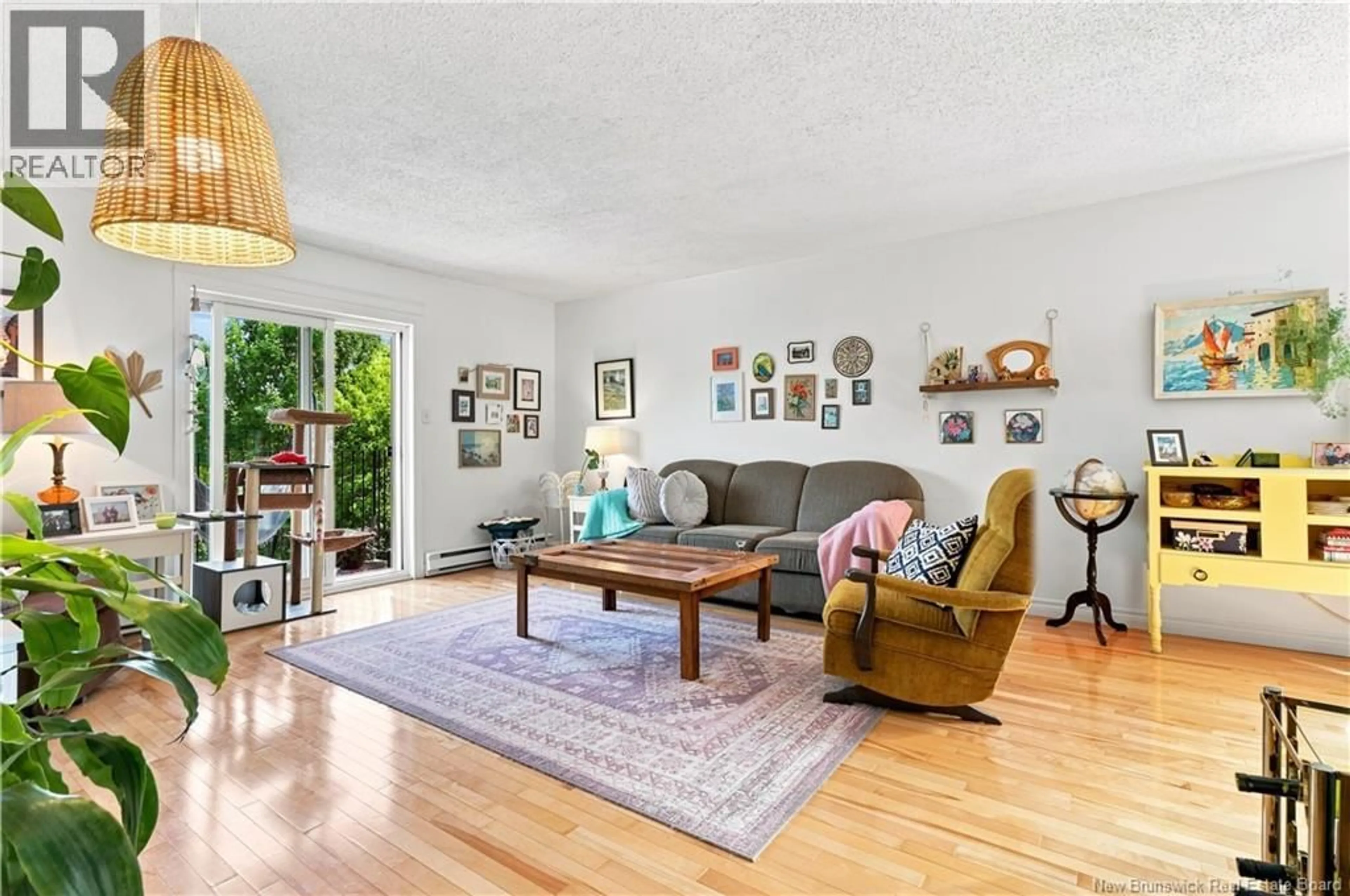Living room with furniture, wood/laminate floor for 14 - 109 BIGGS STREET, Fredericton New Brunswick E3B6H8