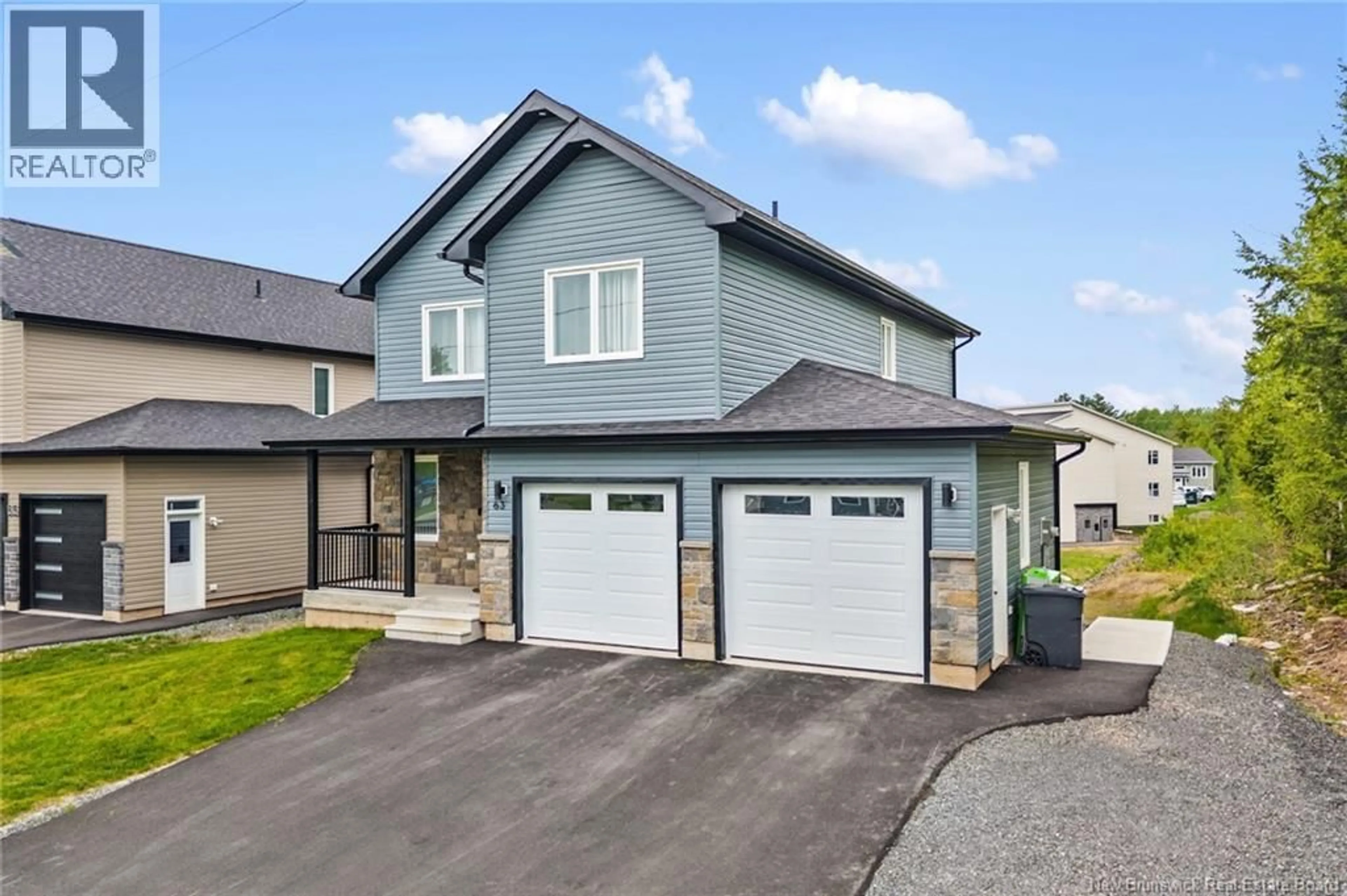 Home with vinyl exterior material, street for 63 WINTERBERRY DRIVE, Fredericton New Brunswick E3C0M3