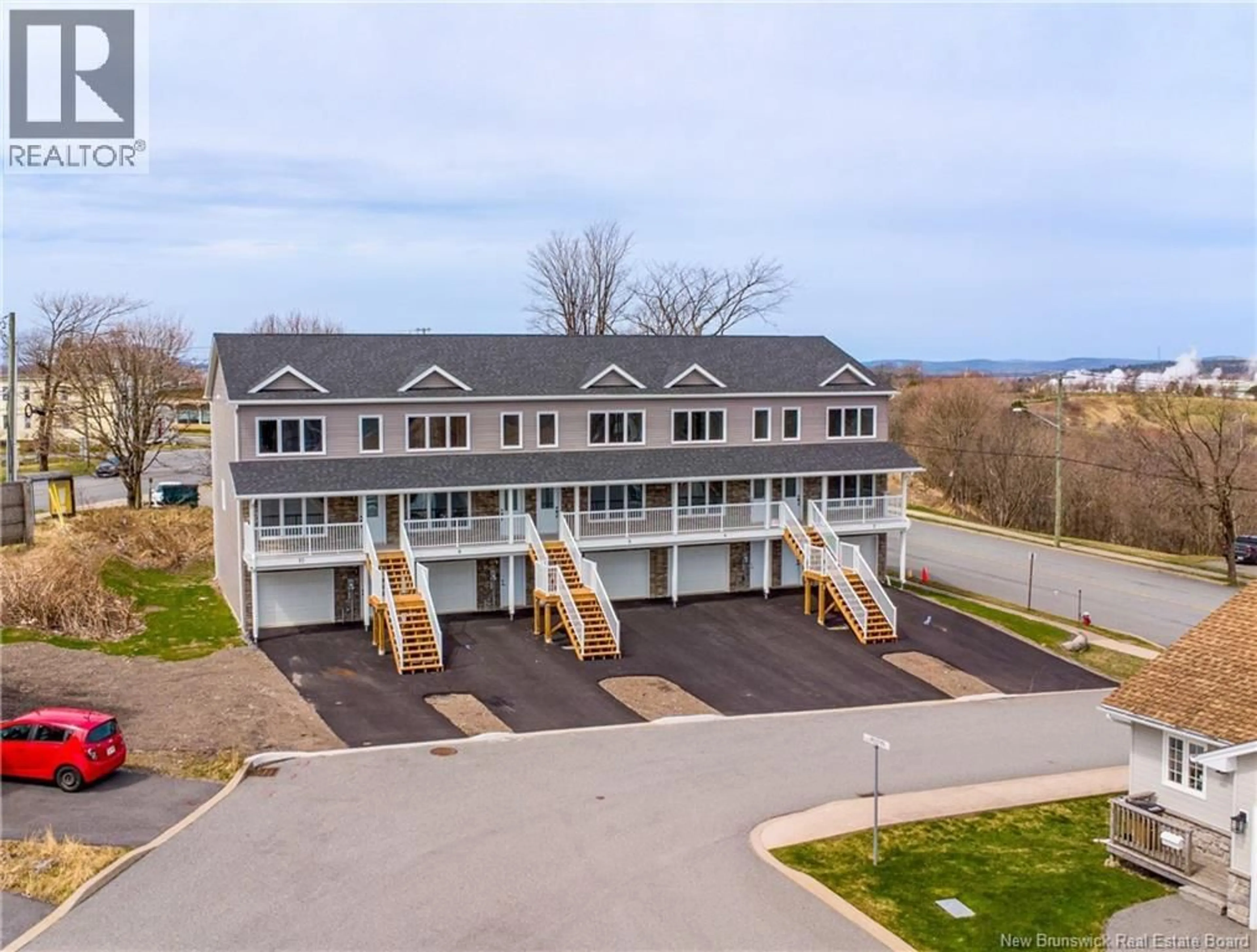 A pic from outside/outdoor area/front of a property/back of a property/a pic from drone, water/lake/river/ocean view for 6 ROCKINGSTONE DRIVE, Saint John New Brunswick E2M0B5