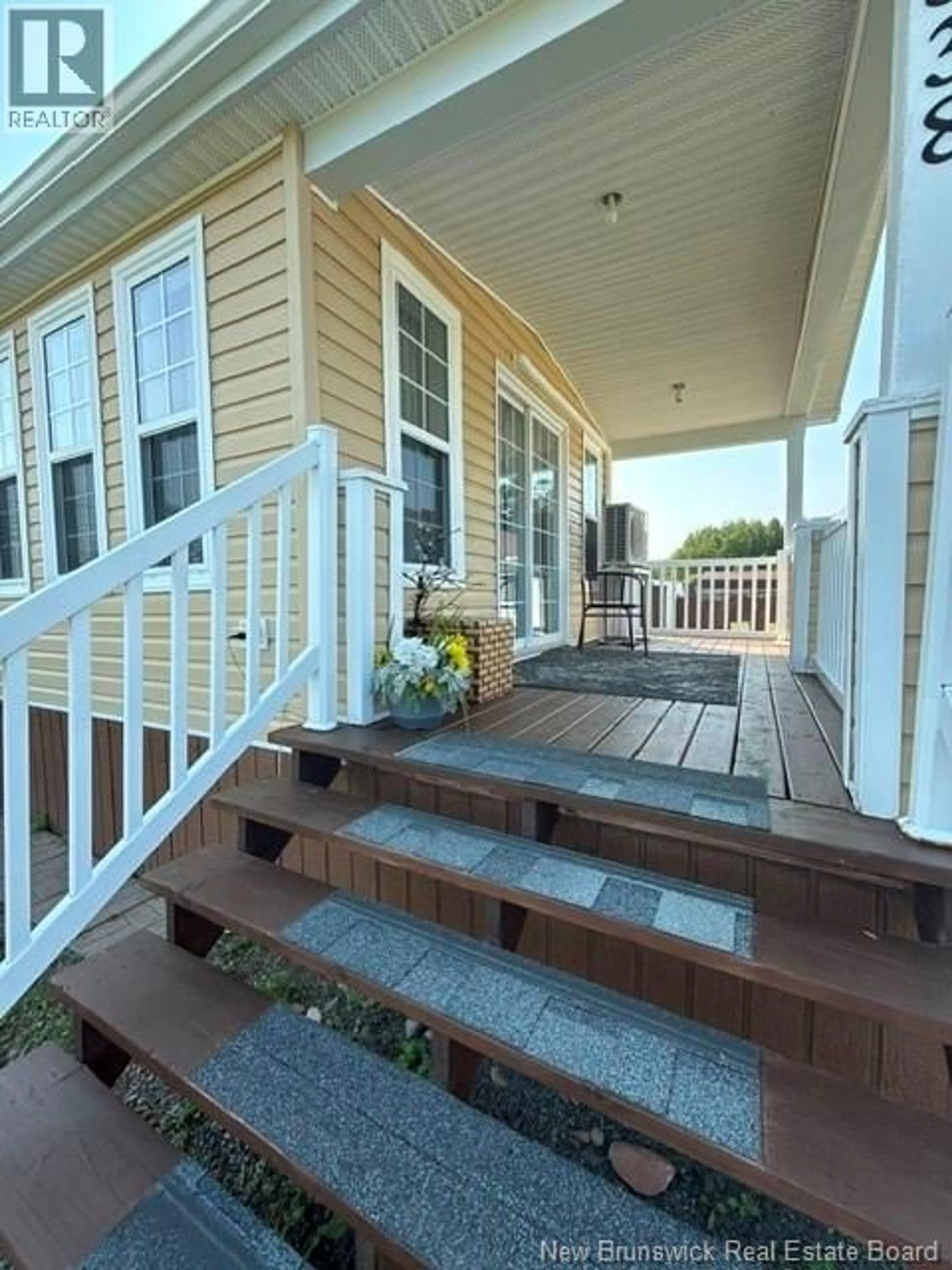 Home with vinyl exterior material, street for 338 JACQUET RIVER DRIVE, Belledune New Brunswick E8G2E9
