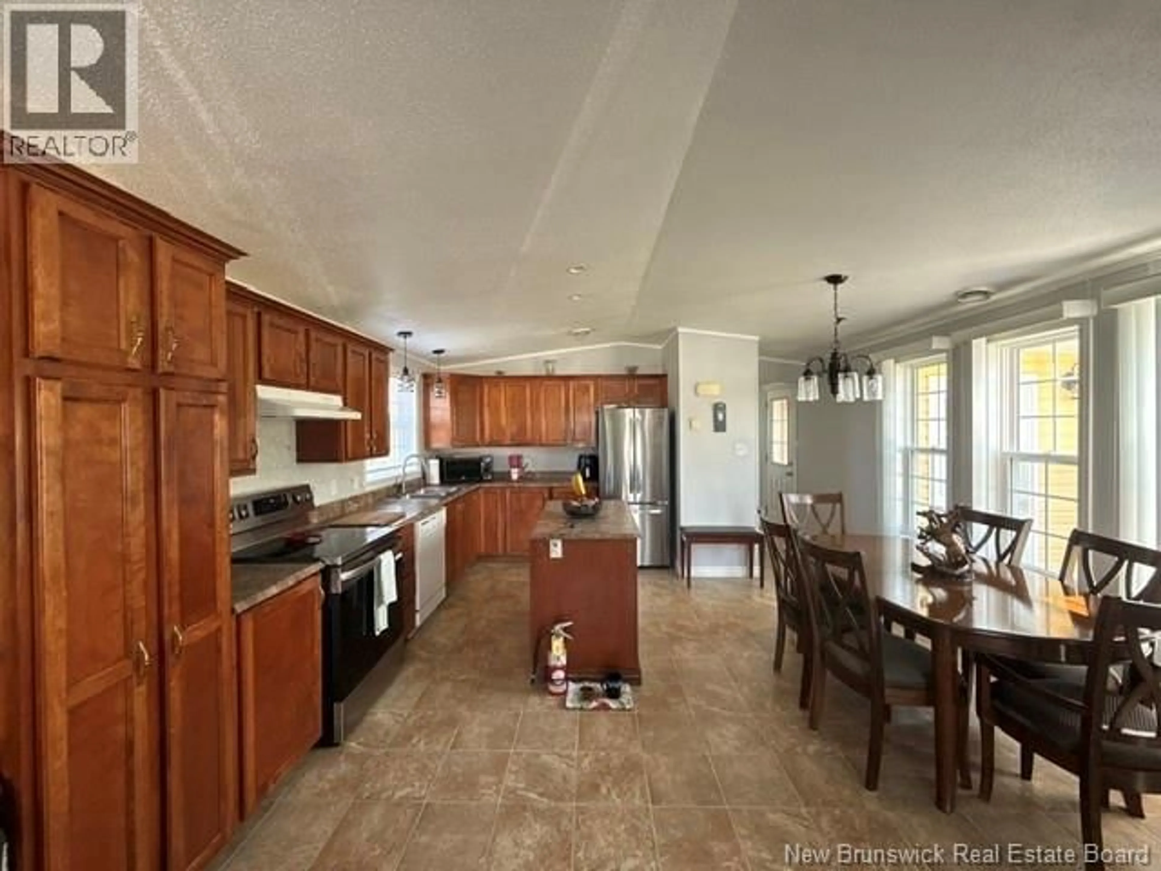 Open concept kitchen, ceramic/tile floor for 338 JACQUET RIVER DRIVE, Belledune New Brunswick E8G2E9