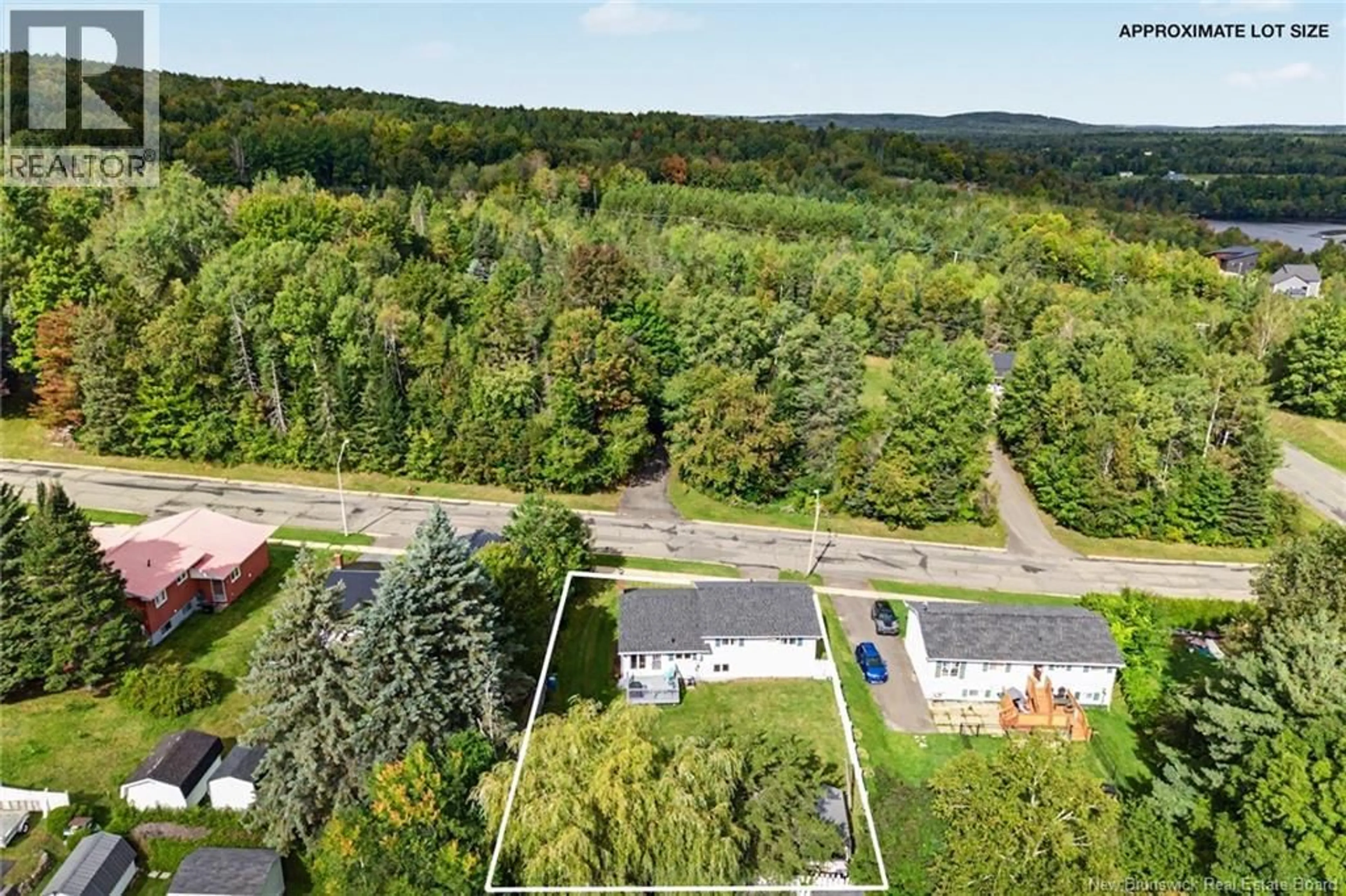 A pic from outside/outdoor area/front of a property/back of a property/a pic from drone, forest/trees view for 12 MCNAIR DRIVE, Nackawic New Brunswick E6G1A7