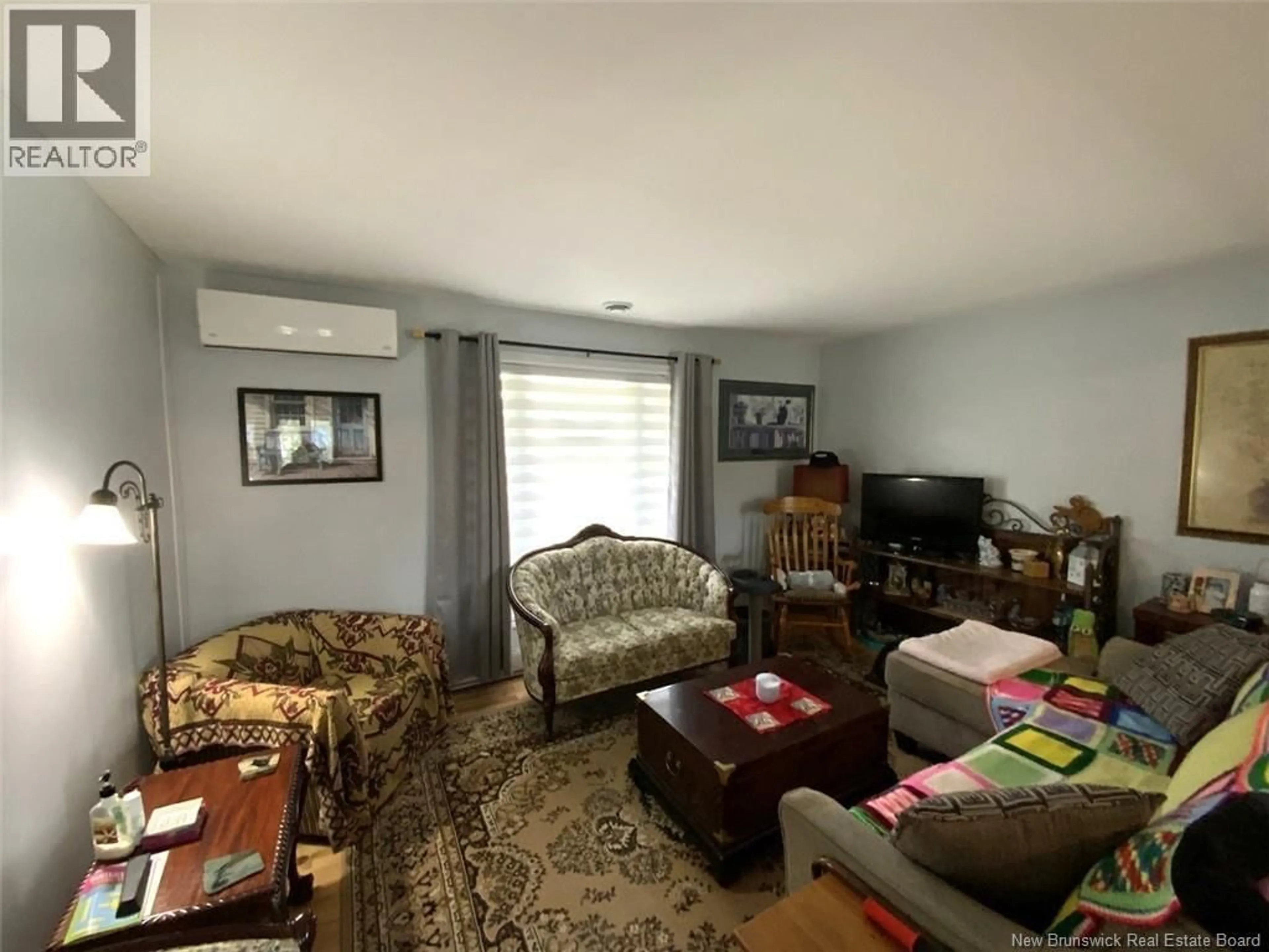 Living room with furniture, unknown for 11 LEBEL STREET, Edmundston New Brunswick E3V3Y3