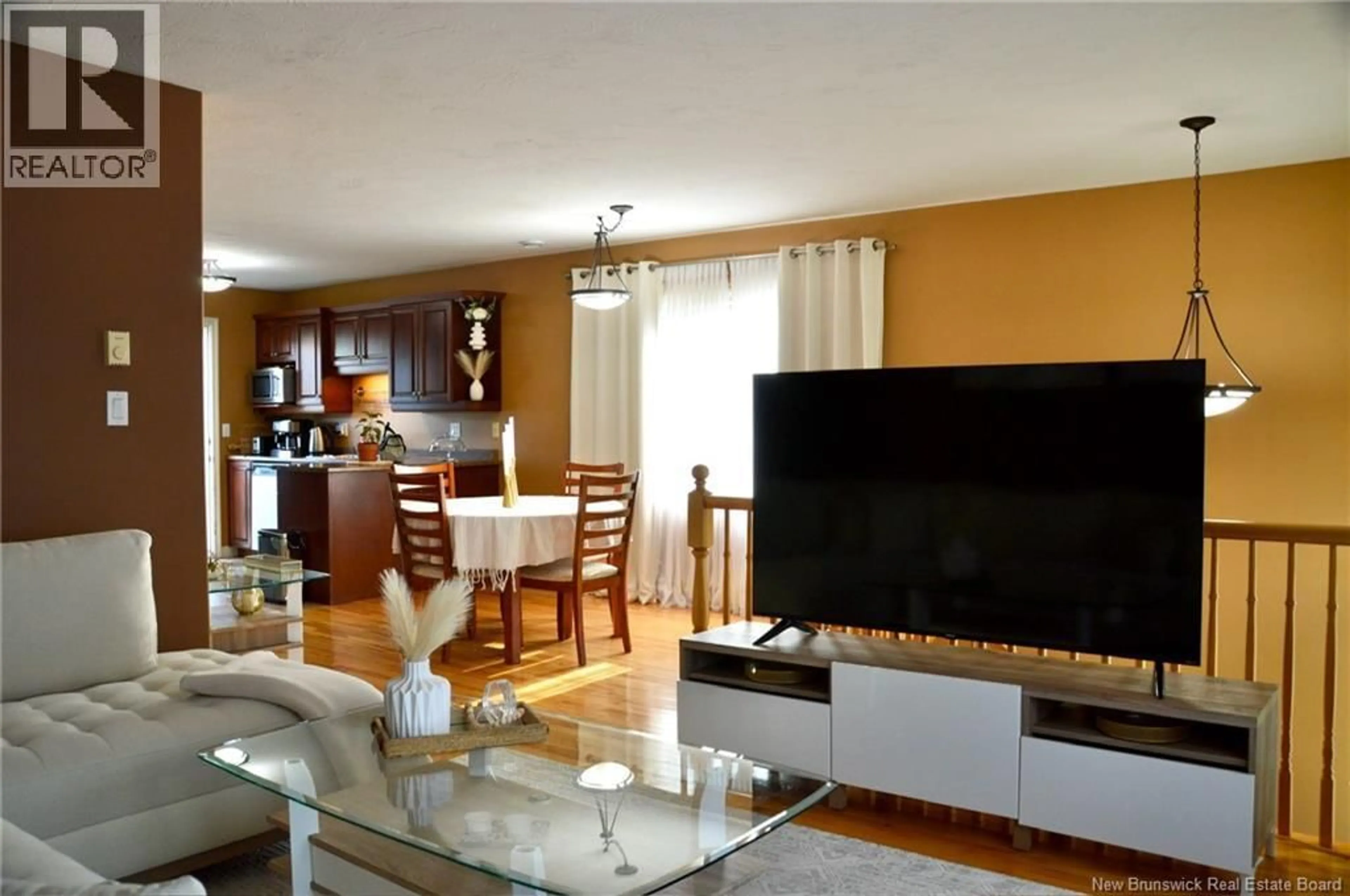 Living room with furniture, wood/laminate floor for 645 MELANSON ROAD, Dieppe New Brunswick E1A1A5