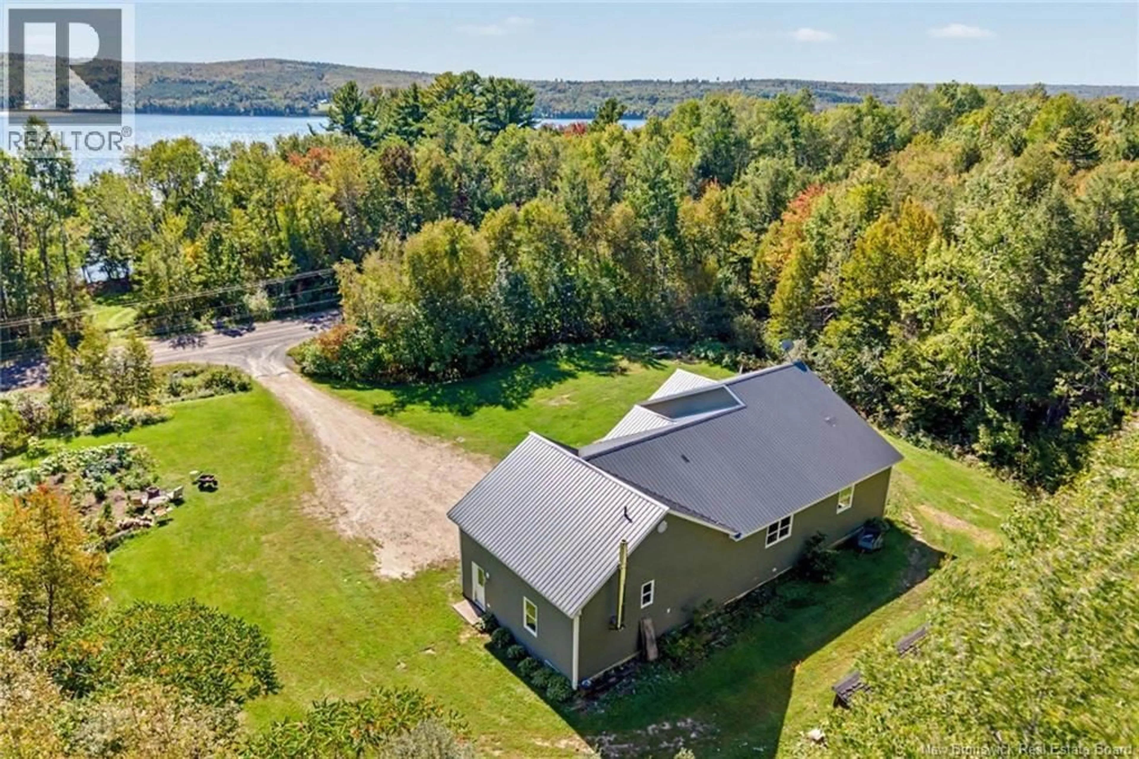 A pic from outside/outdoor area/front of a property/back of a property/a pic from drone, water/lake/river/ocean view for 3442 ROUTE 105, Bear Island New Brunswick E6L1J3