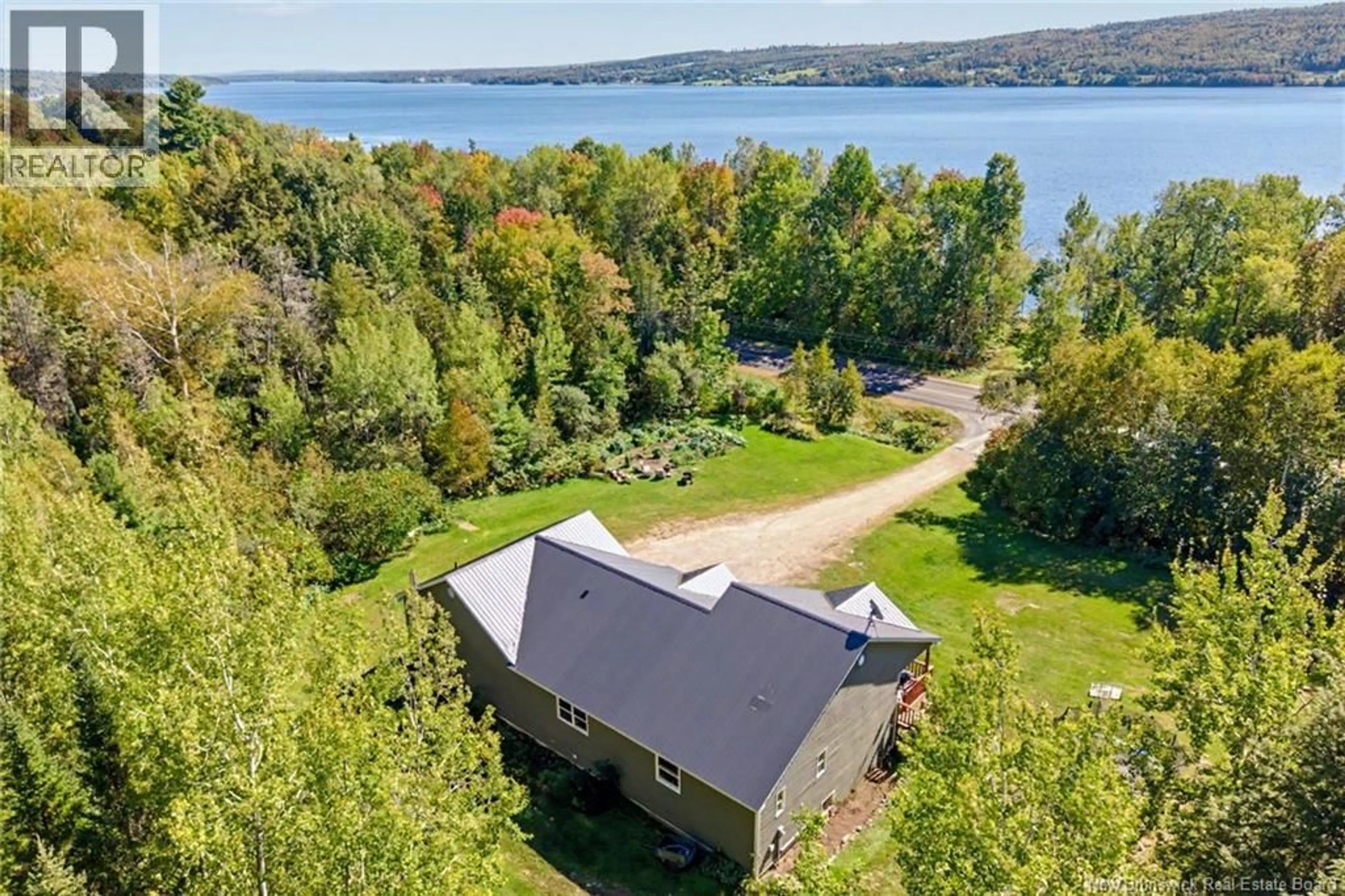 A pic from outside/outdoor area/front of a property/back of a property/a pic from drone, water/lake/river/ocean view for 3442 ROUTE 105, Bear Island New Brunswick E6L1J3