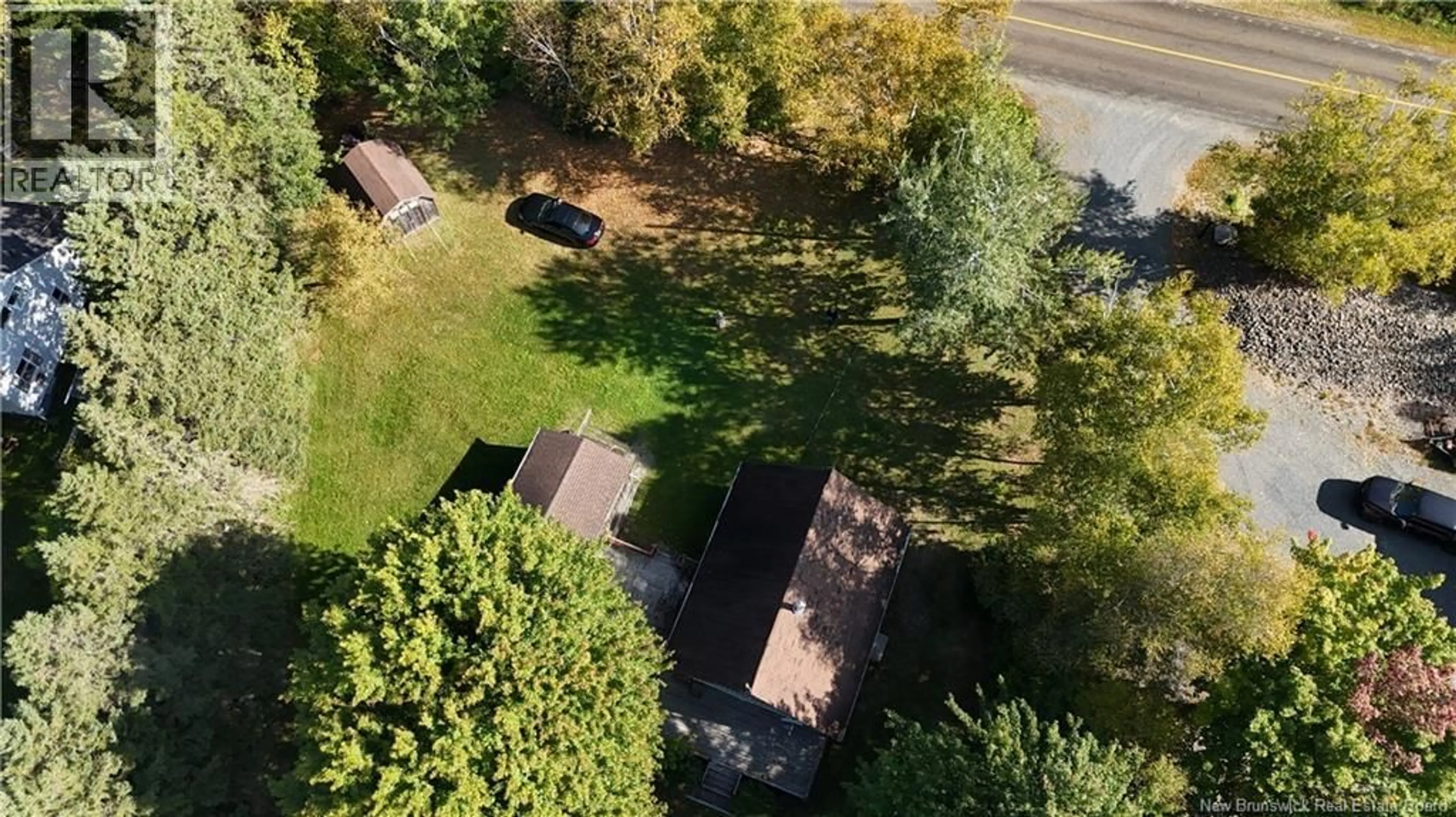 A pic from outside/outdoor area/front of a property/back of a property/a pic from drone, forest/trees view for 3073 ROUTE 105, Bear Island New Brunswick E6L2X2