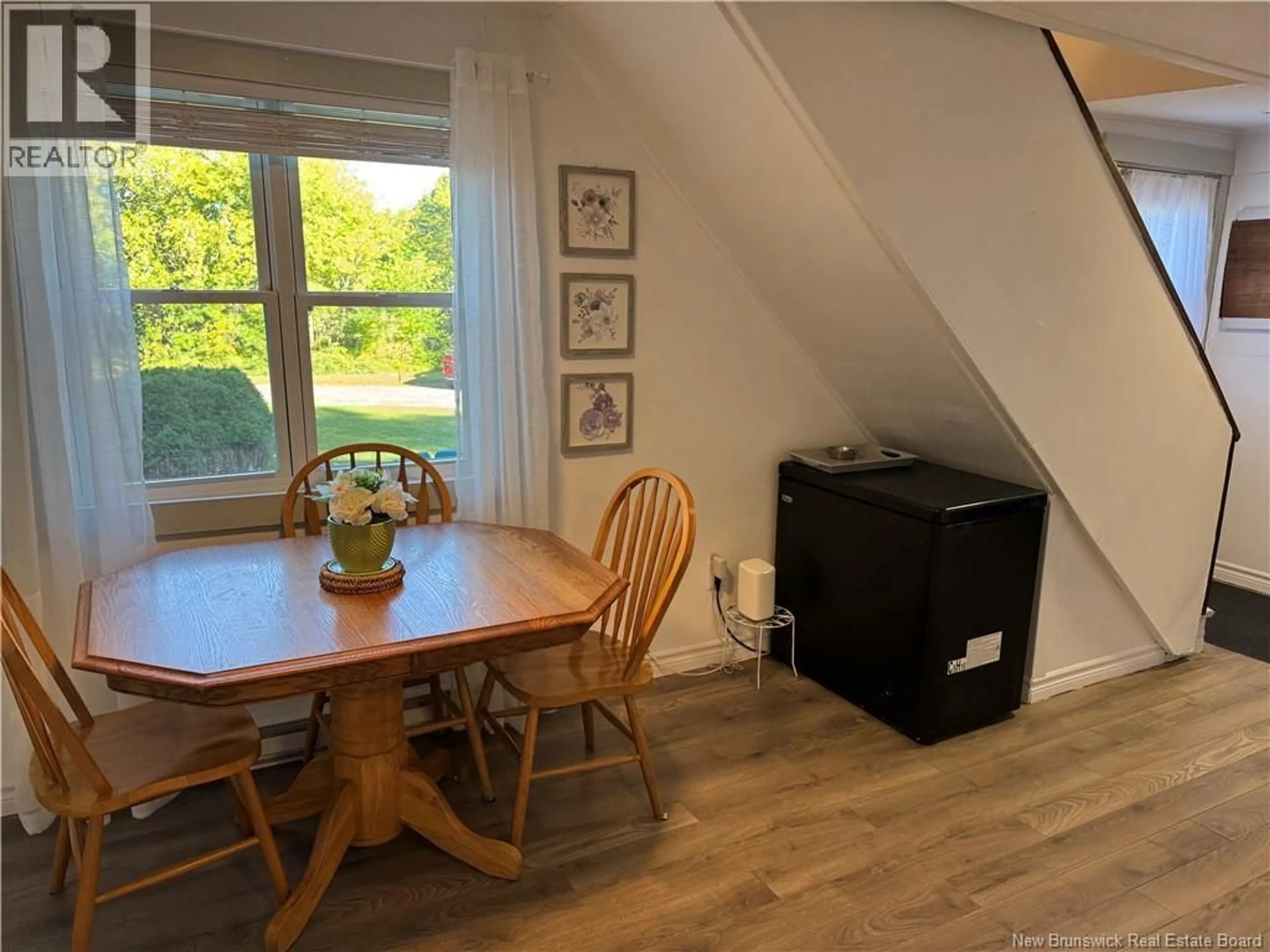 Dining room, wood/laminate floor for 30 QUEEN ST, Hartland New Brunswick E7P2M2