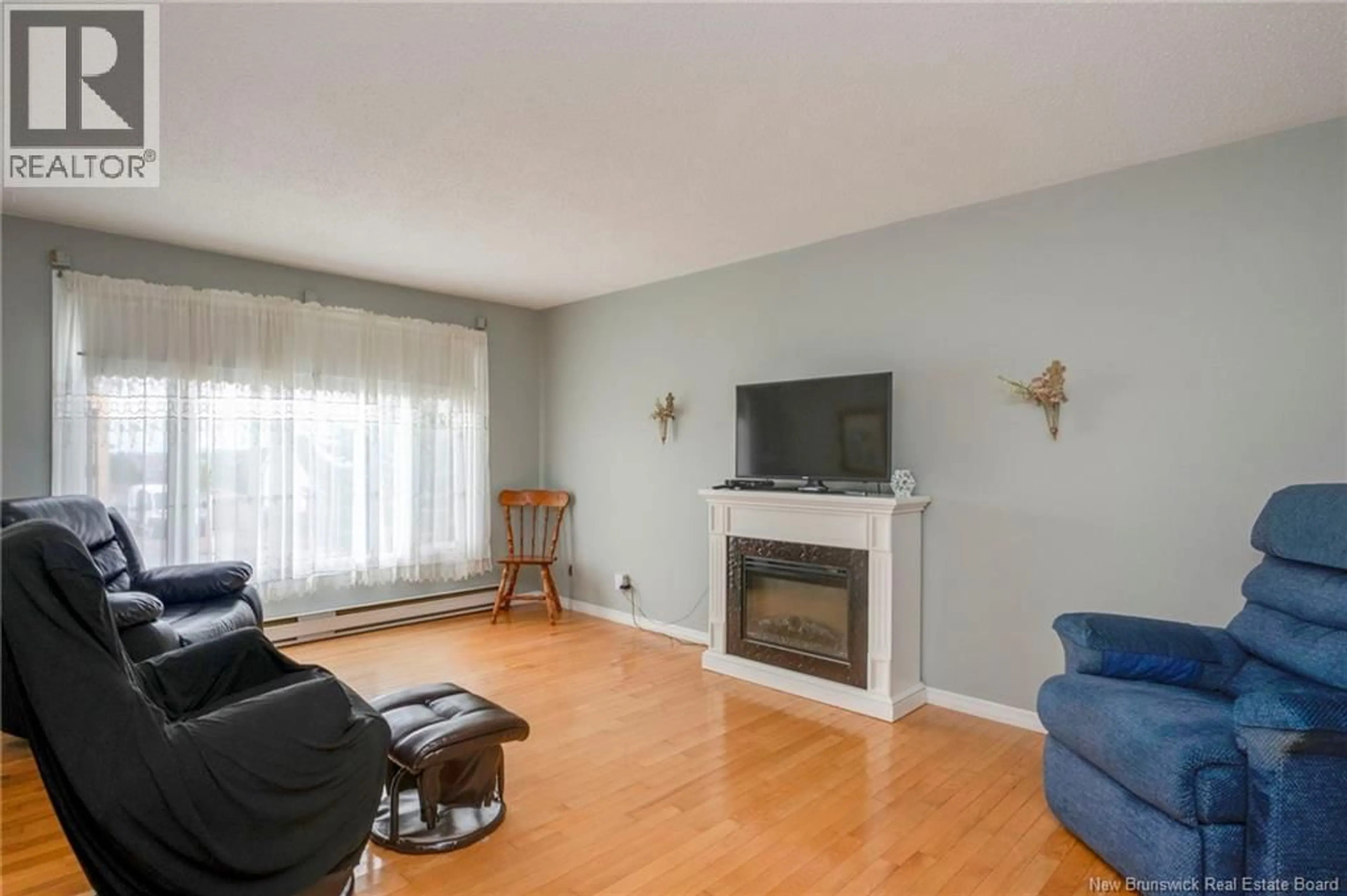 Living room with furniture, wood/laminate floor for 18 ST.ANNE STREET, Saint John New Brunswick E2J2N9