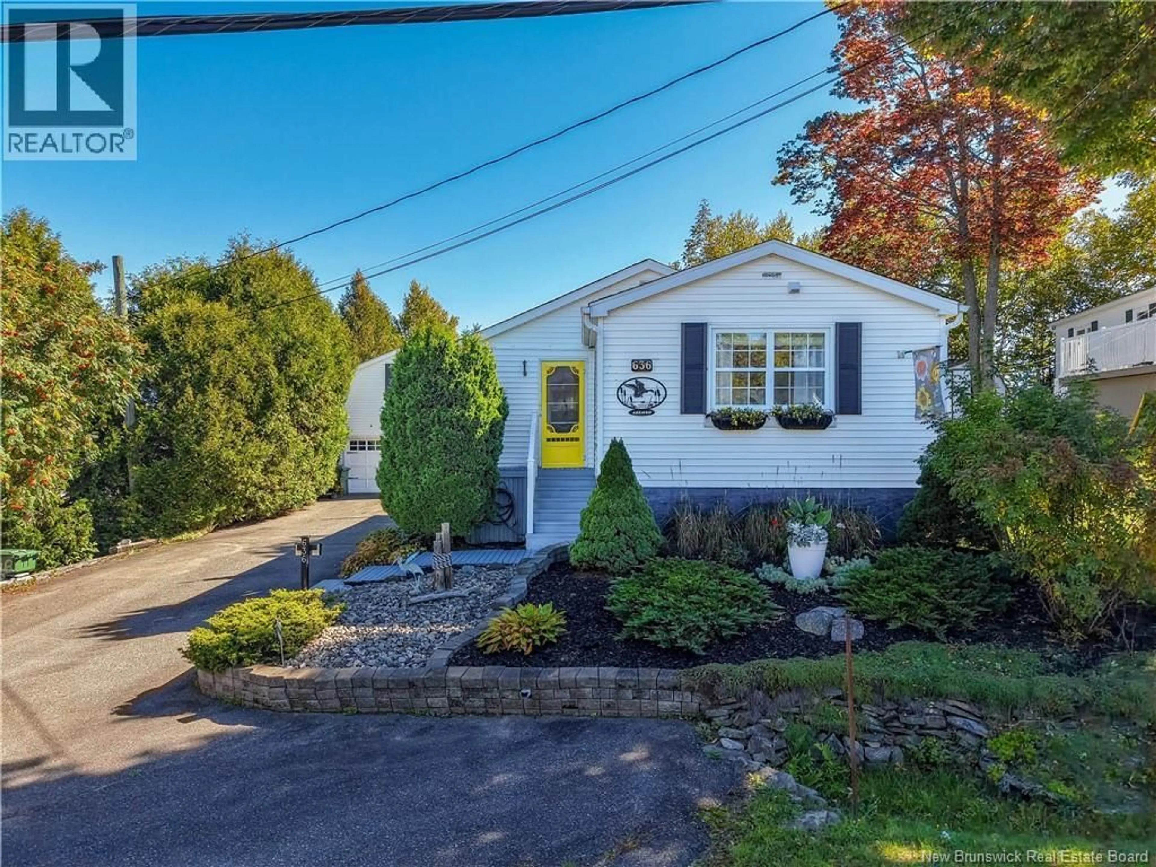 Home with vinyl exterior material, street for 636 BARCLAY LOOP, Fredericton New Brunswick E3B7L8
