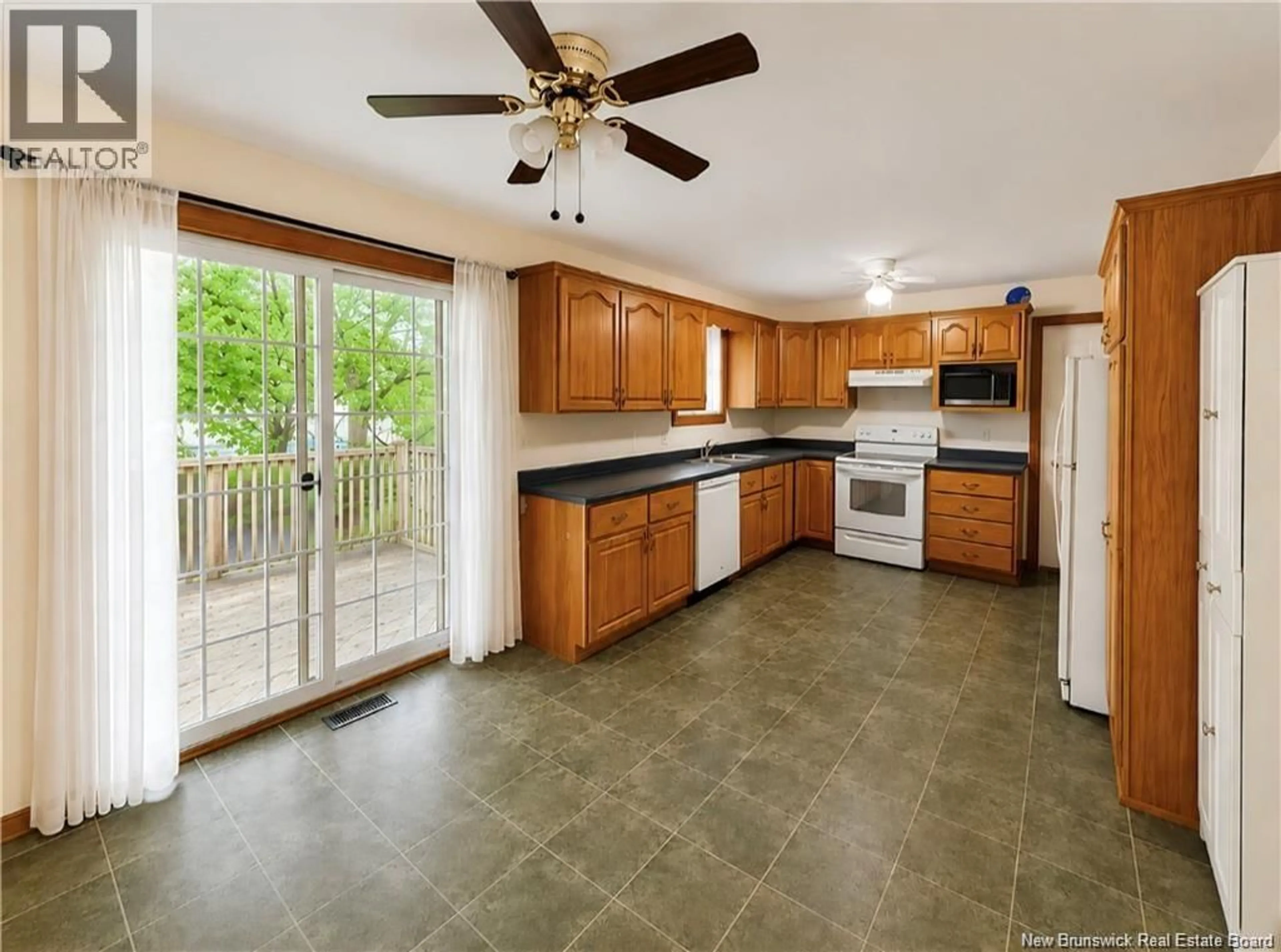 Open concept kitchen, ceramic/tile floor for 23 PEMBROKE STREET, Riverview New Brunswick E1B3Z9