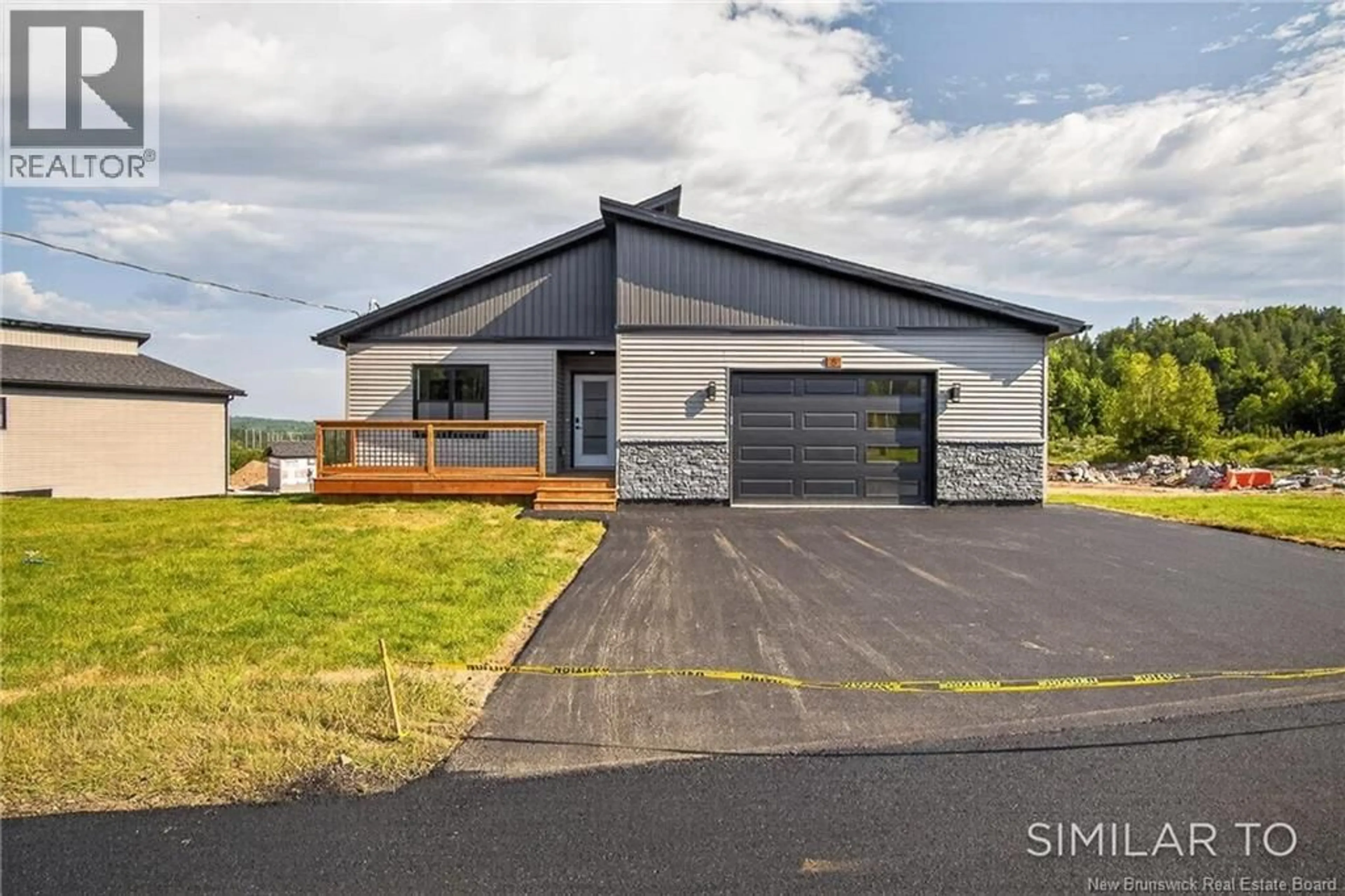Home with vinyl exterior material, street for 18 BELLBOTTOM WAY, Quispamsis New Brunswick E2G0K9