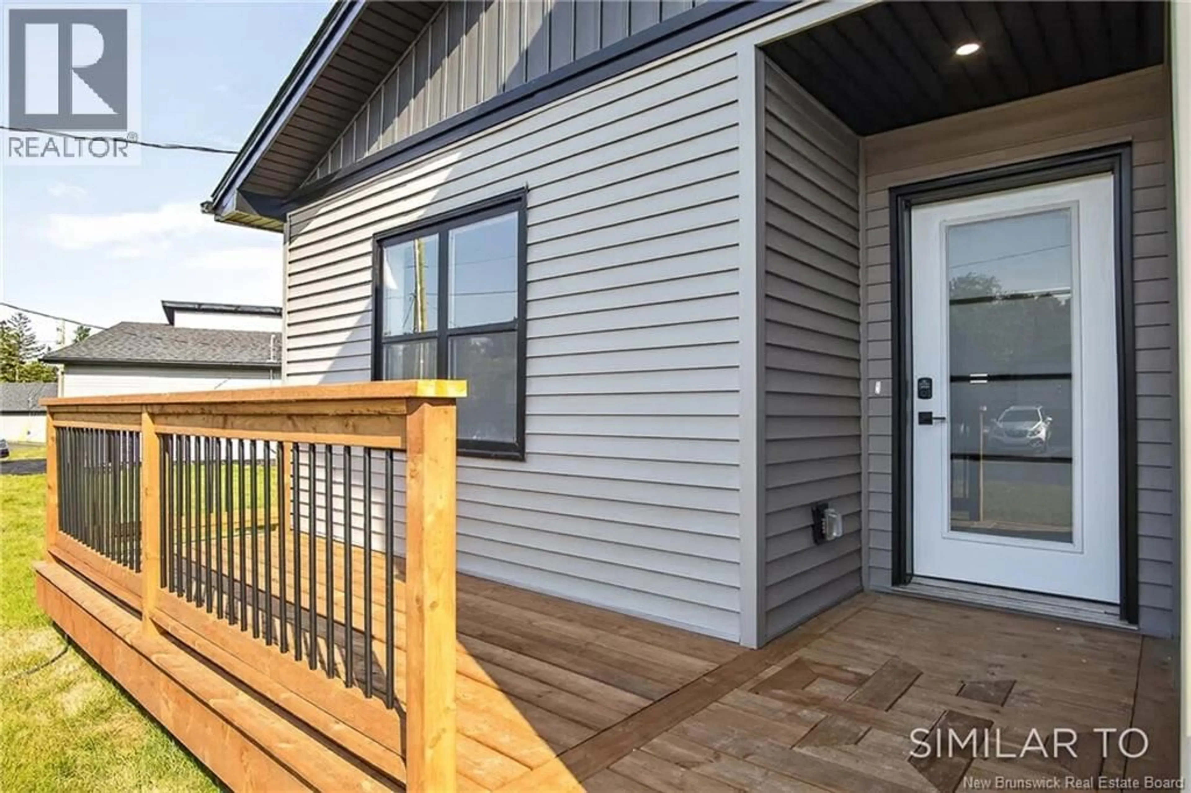 Home with vinyl exterior material, street for 18 BELLBOTTOM WAY, Quispamsis New Brunswick E2G0K9
