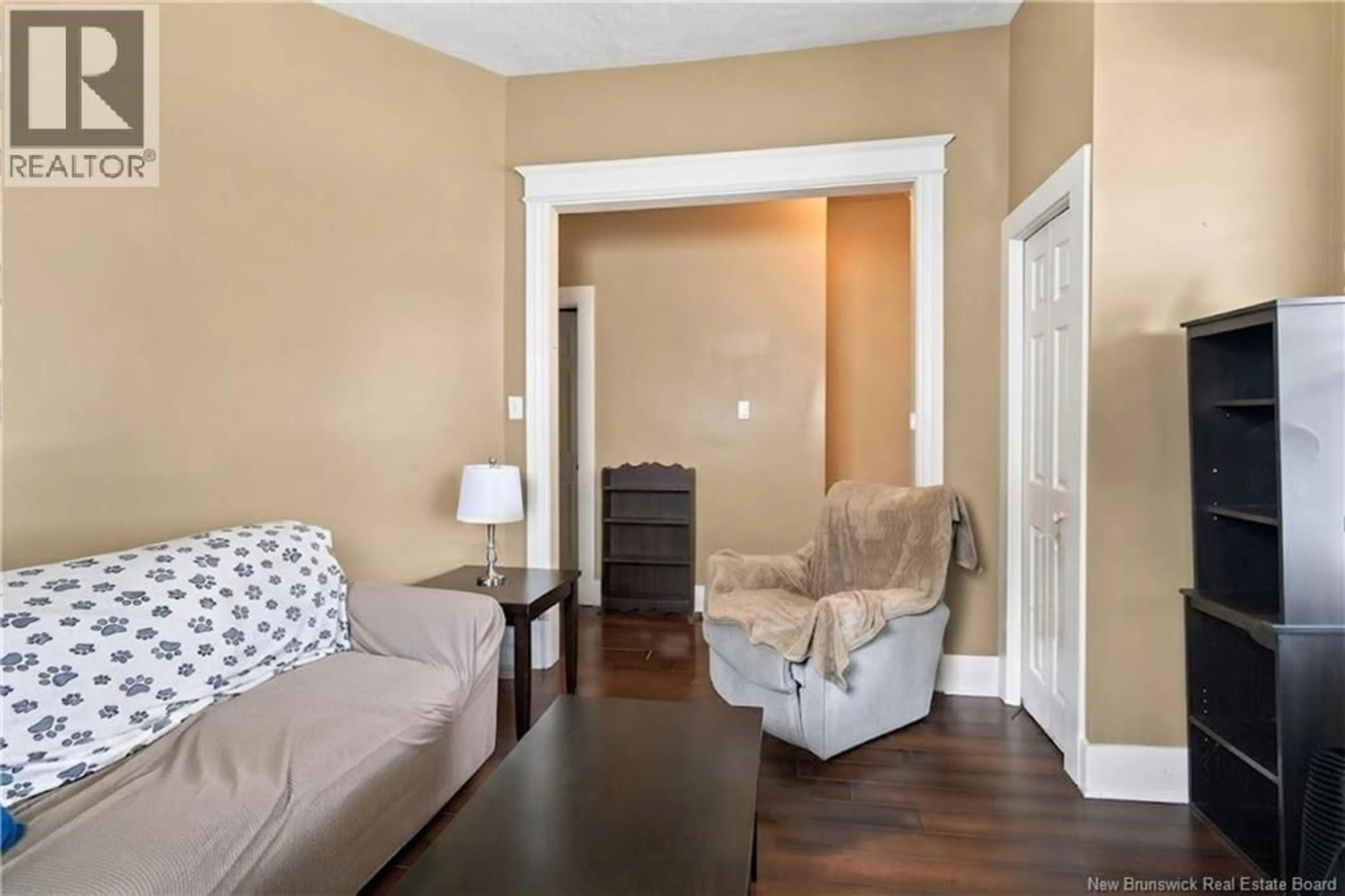 Living room with furniture, wood/laminate floor for 142 DUFFERIN, Moncton New Brunswick E1C1Z3