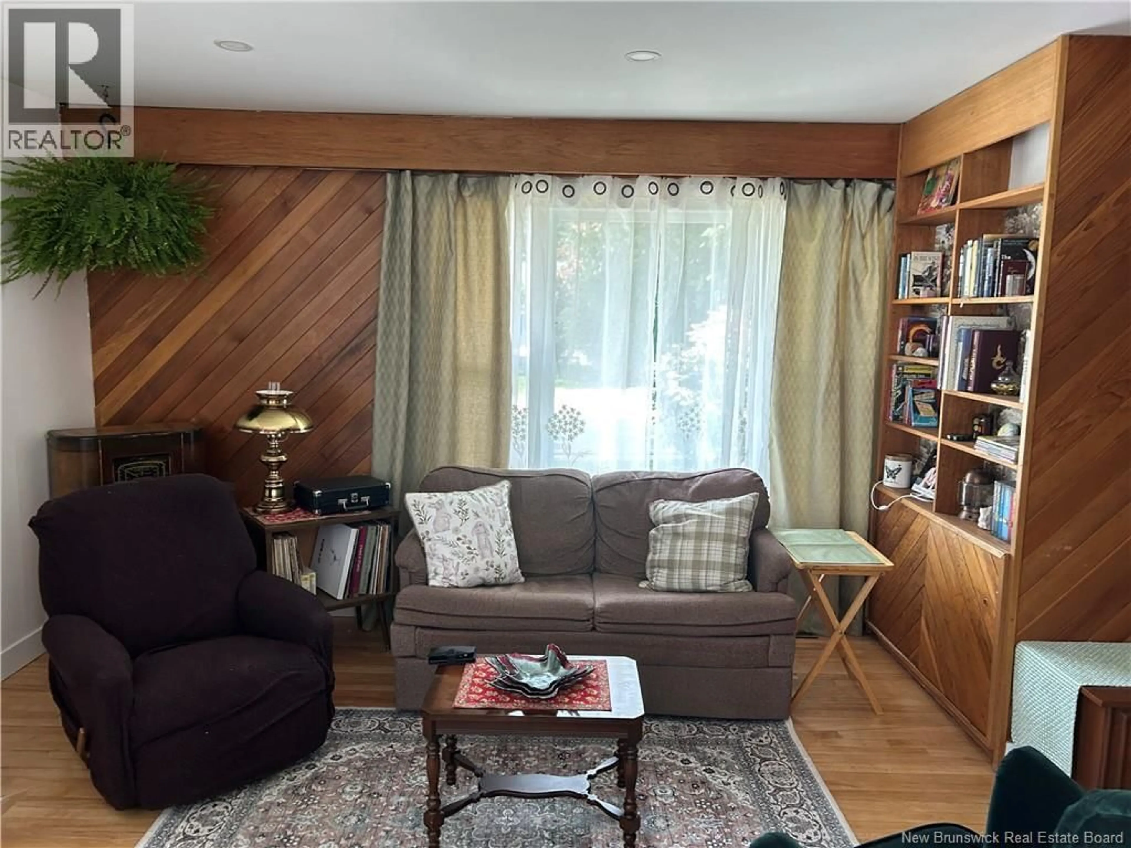Living room with furniture, wood/laminate floor for 68 CHAMPLAIN DRIVE, Saint John New Brunswick E2J3C8