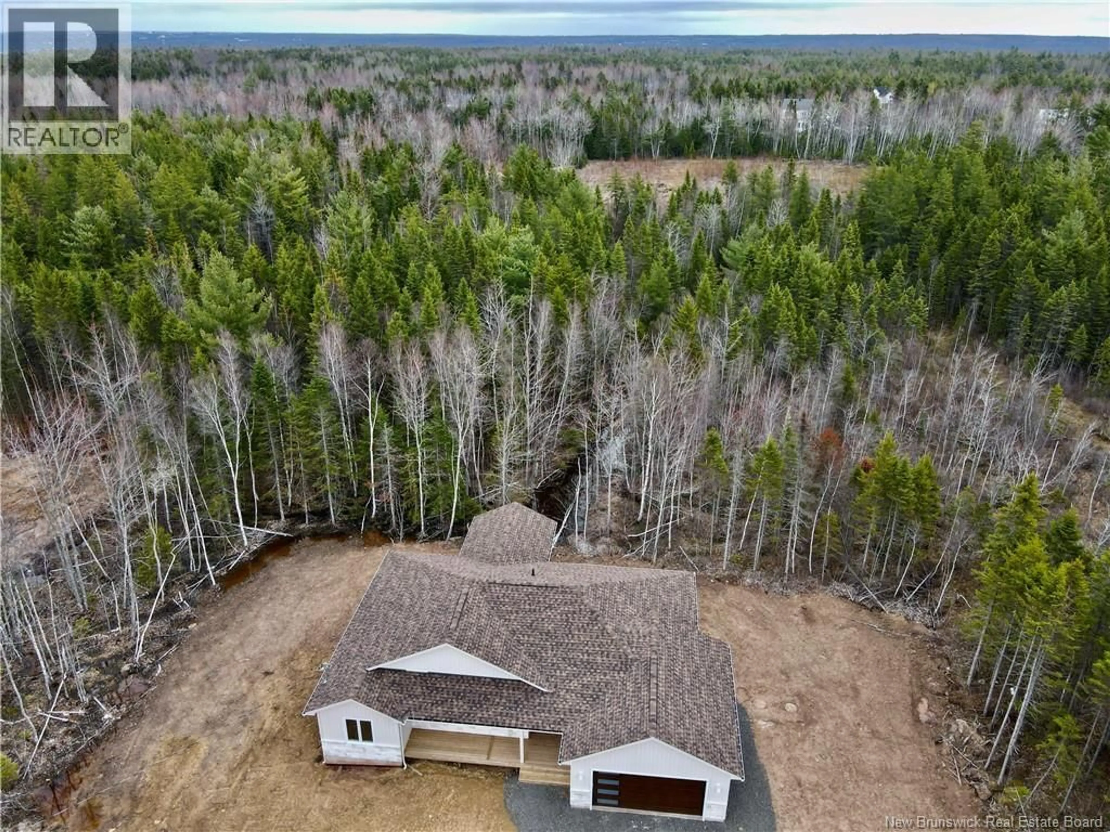 A pic from outside/outdoor area/front of a property/back of a property/a pic from drone, forest/trees view for 82 MAEFIELD STREET, Lower Coverdale New Brunswick E1J0E7