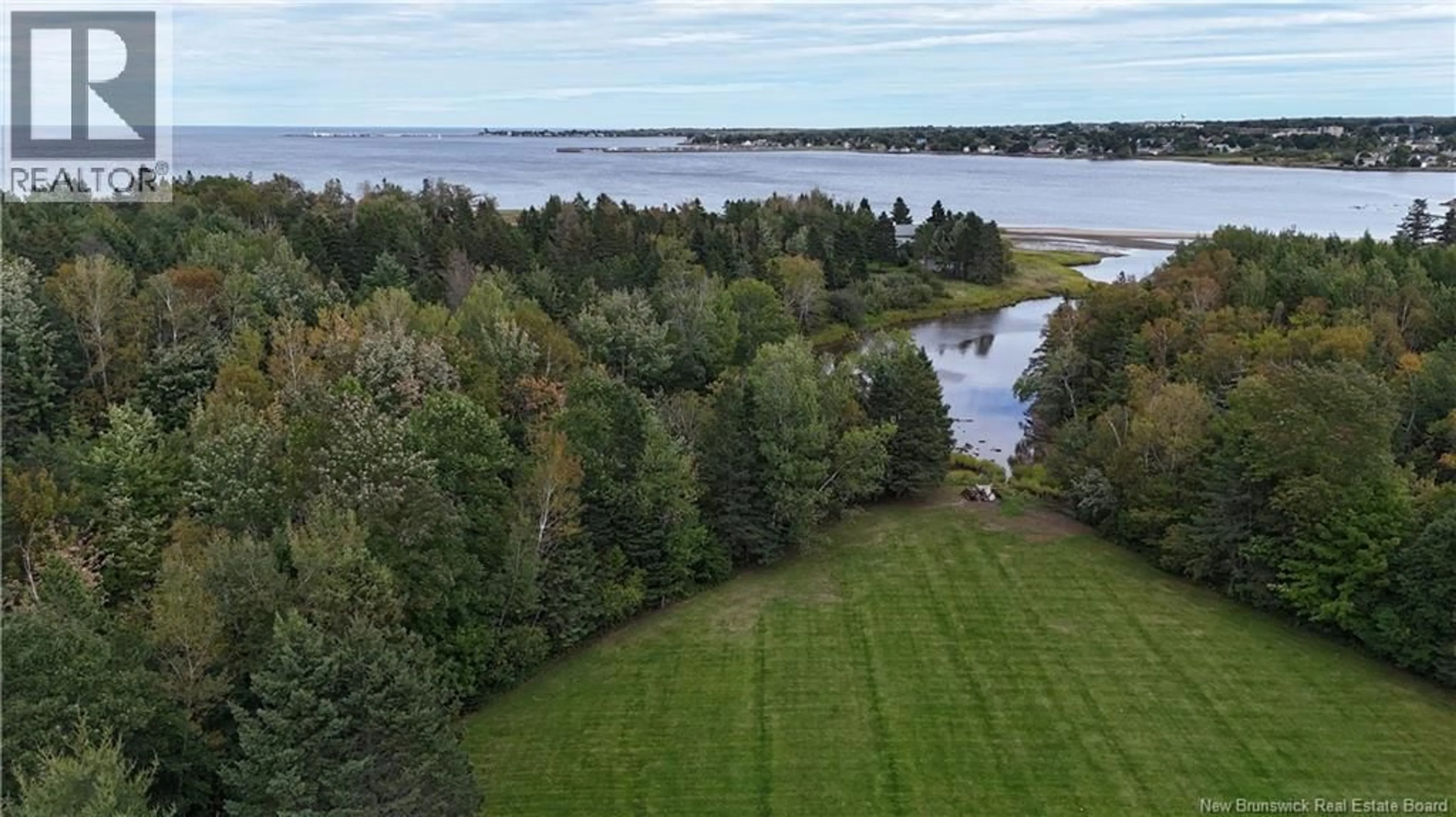 A pic from outside/outdoor area/front of a property/back of a property/a pic from drone, water/lake/river/ocean view for 102 ROUTE 133, Shediac Cape New Brunswick E4P3C8