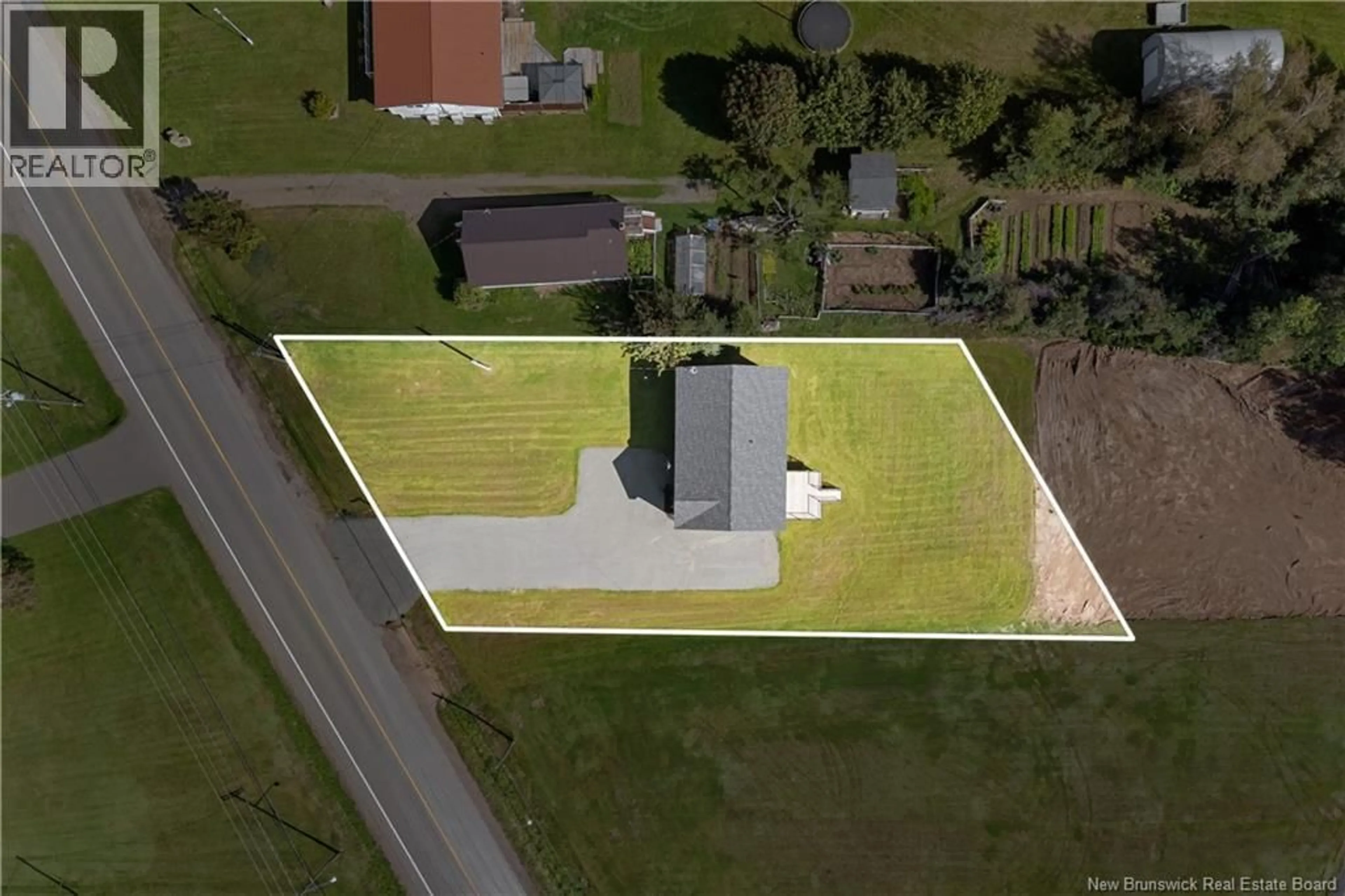 A pic from outside/outdoor area/front of a property/back of a property/a pic from drone, building for 979 RTE 133, Grand-Barachois New Brunswick E4P8C2