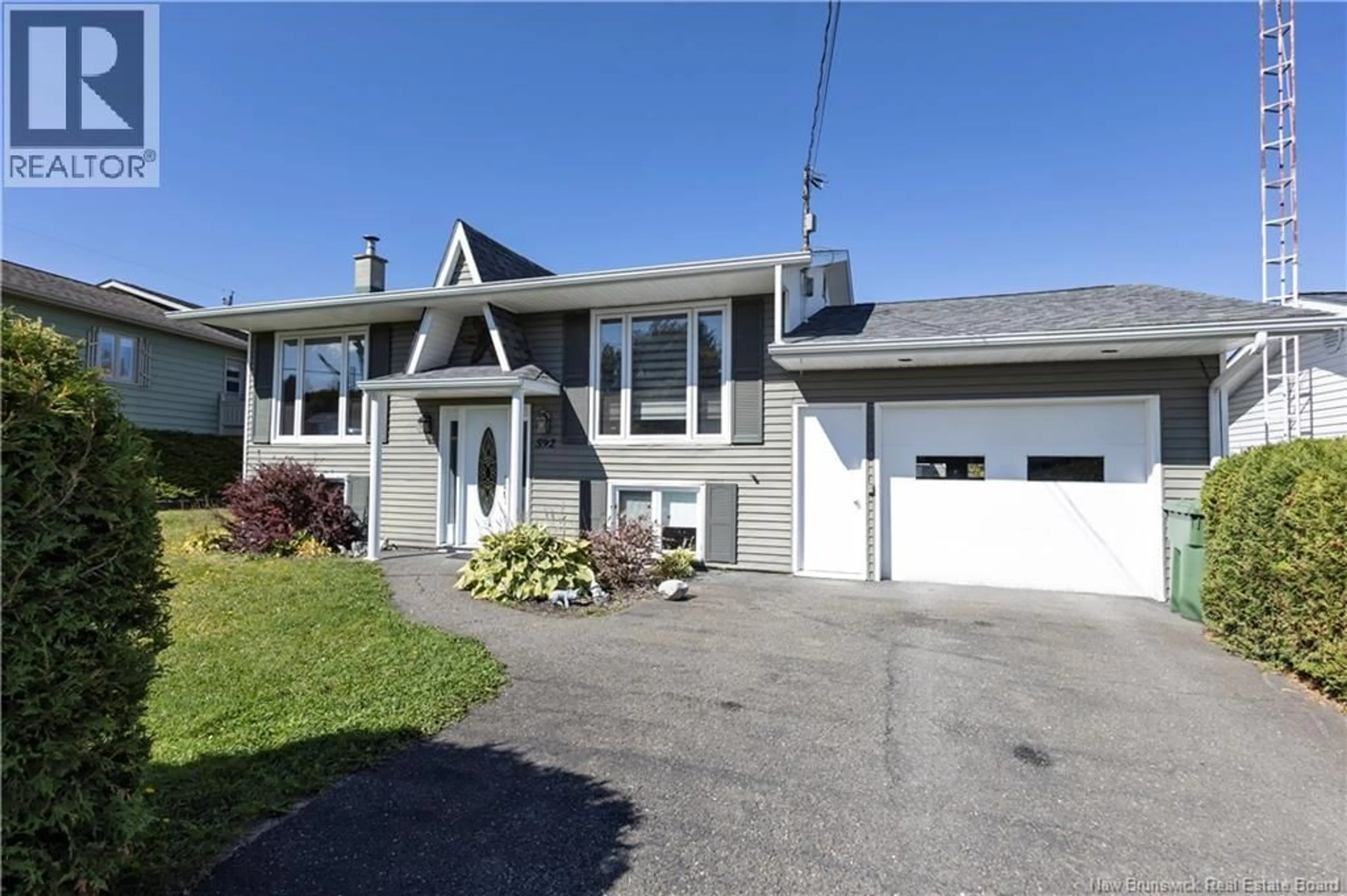 Home with vinyl exterior material, street for 592 FIRST AVENUE, Grand-Sault/Grand Falls New Brunswick E3Z1B3
