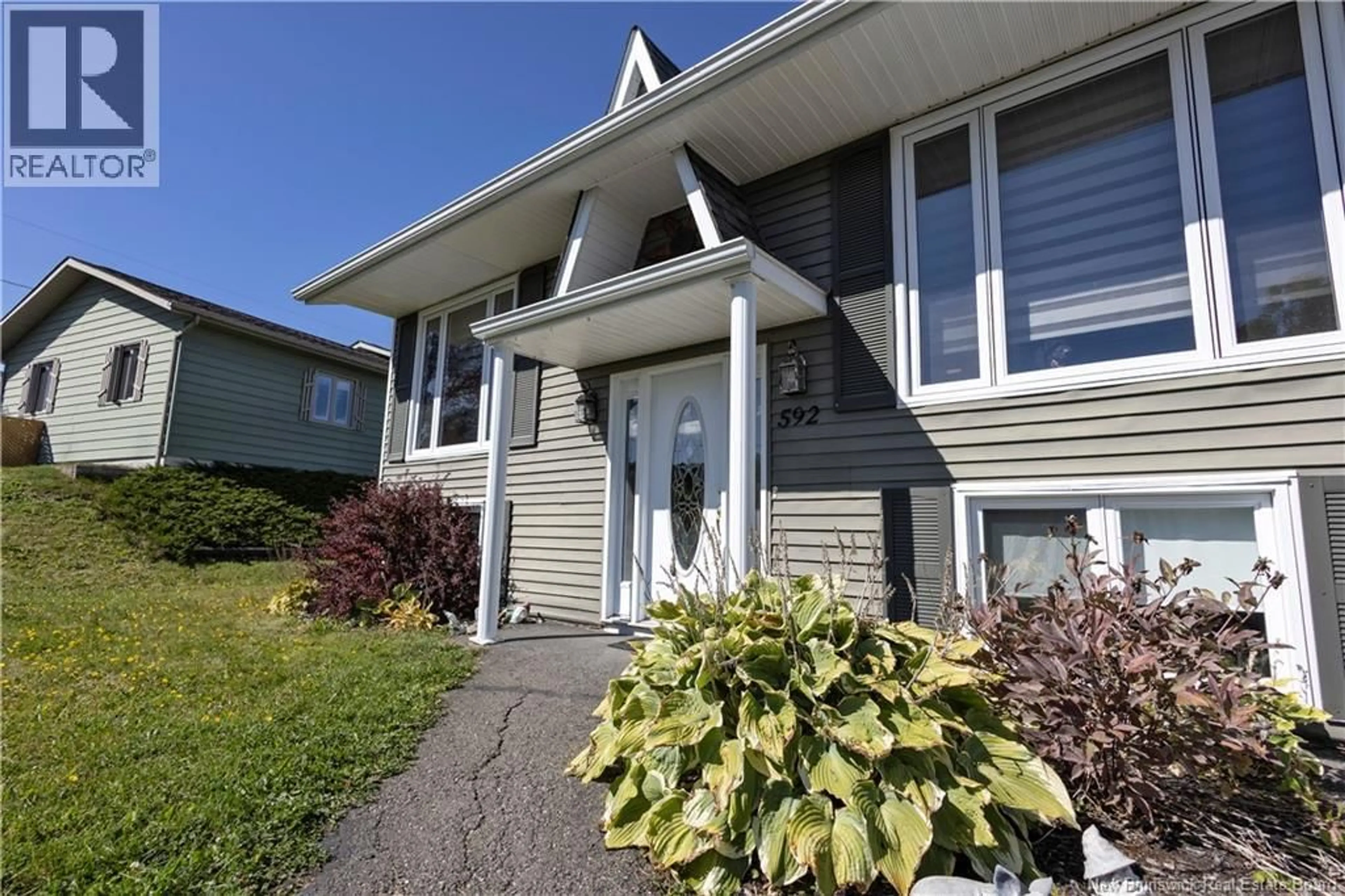 Home with vinyl exterior material, street for 592 FIRST AVENUE, Grand-Sault/Grand Falls New Brunswick E3Z1B3