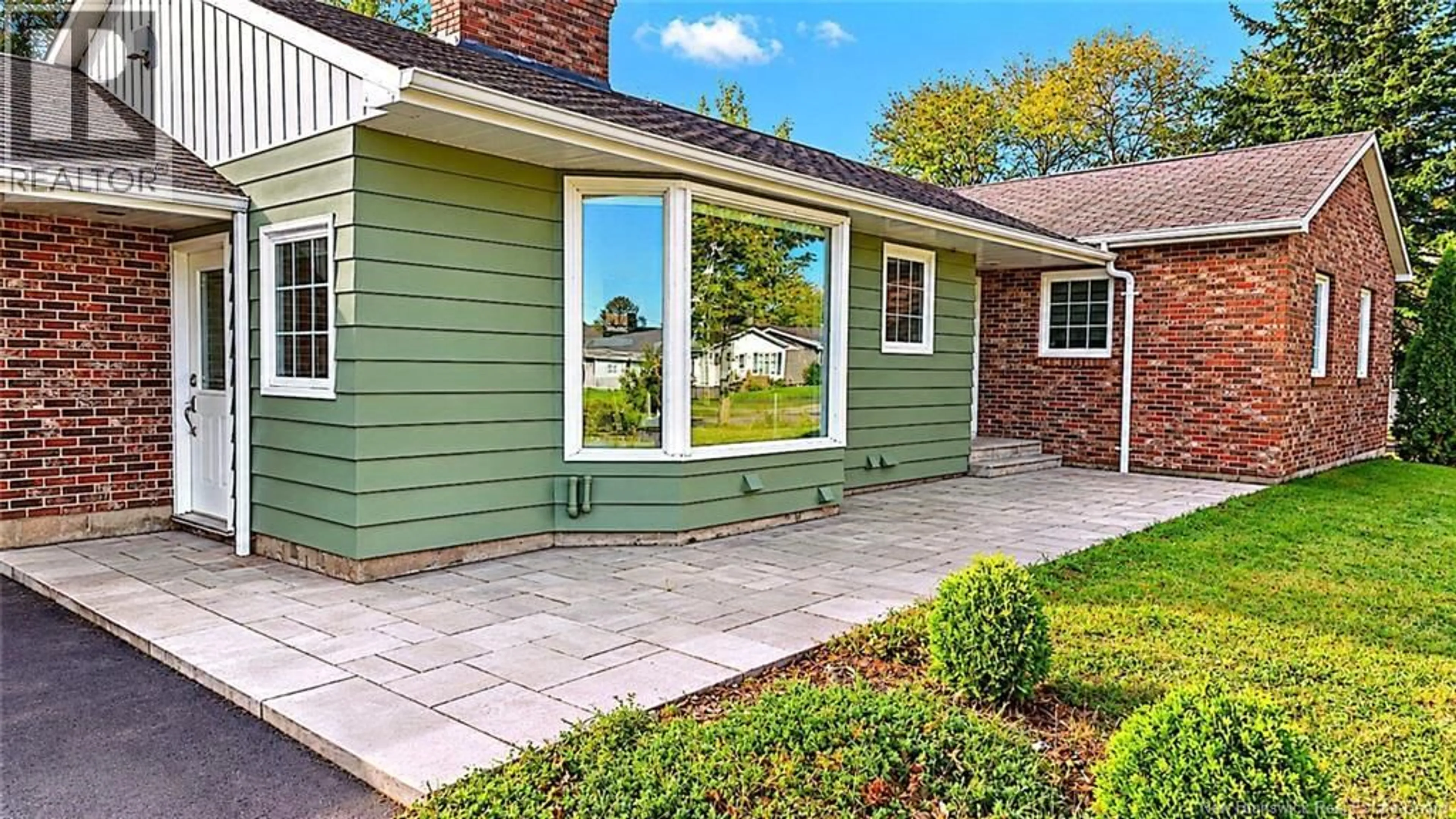 Home with vinyl exterior material, street for 496 BREAU RUE, Tracadie New Brunswick E1X1E3