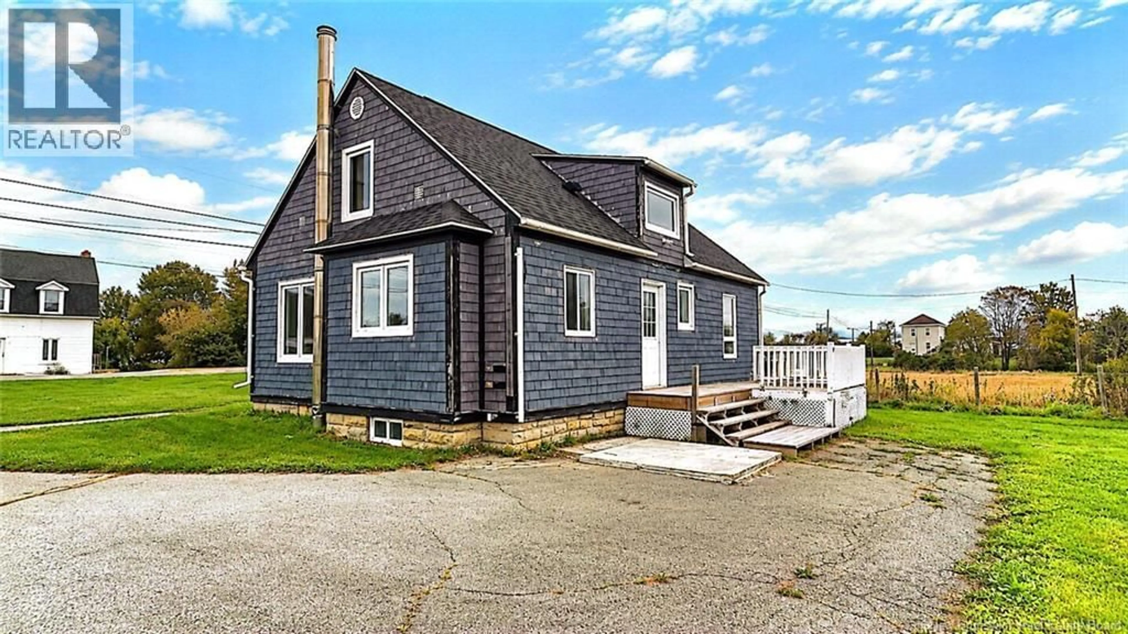 Home with vinyl exterior material, street for 275 RUE ACADIE, Grande-Anse New Brunswick E8N1B9
