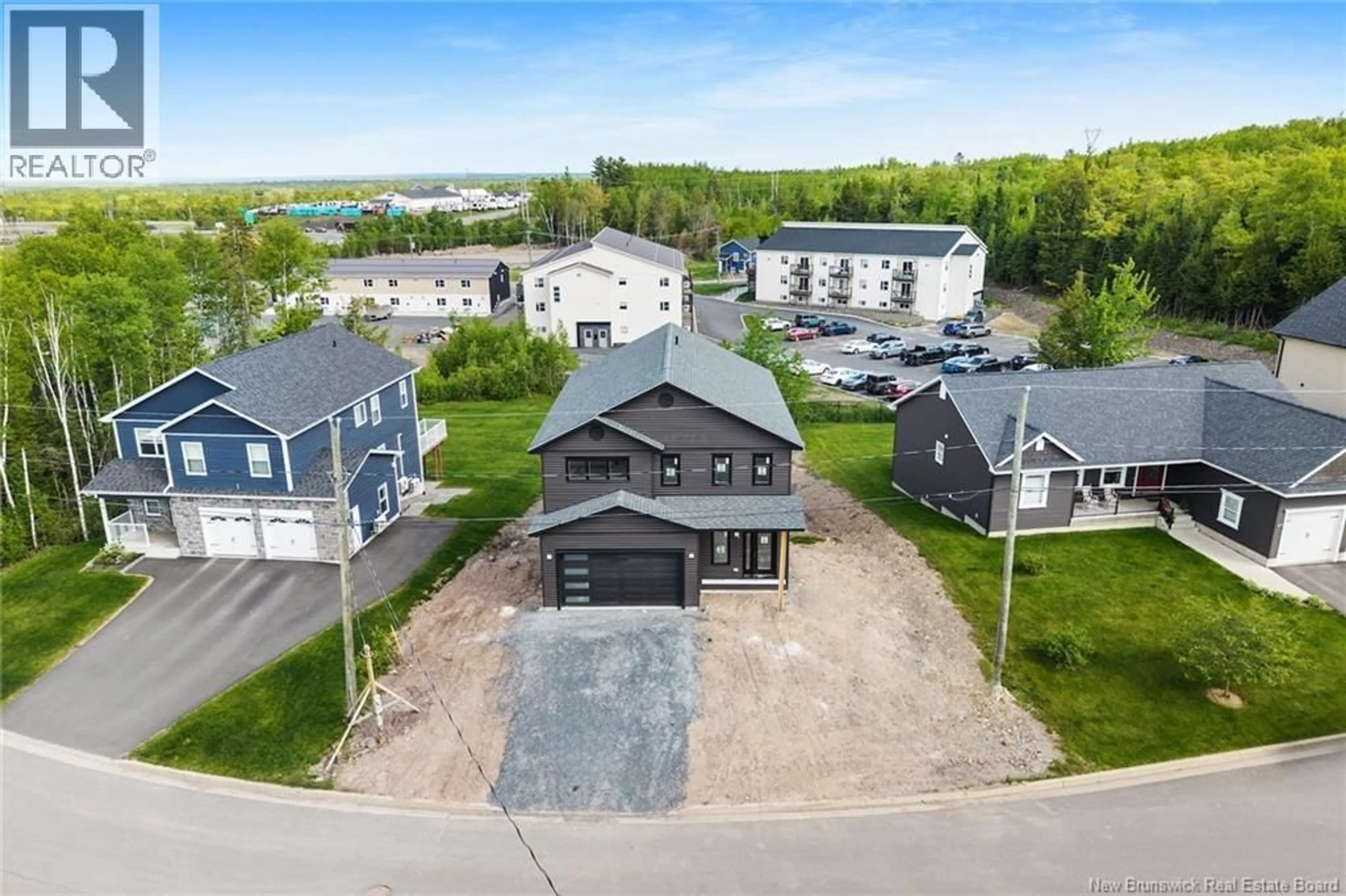 A pic from outside/outdoor area/front of a property/back of a property/a pic from drone, unknown for 39 WINTERBERRY DRIVE, Fredericton New Brunswick E3C0M3